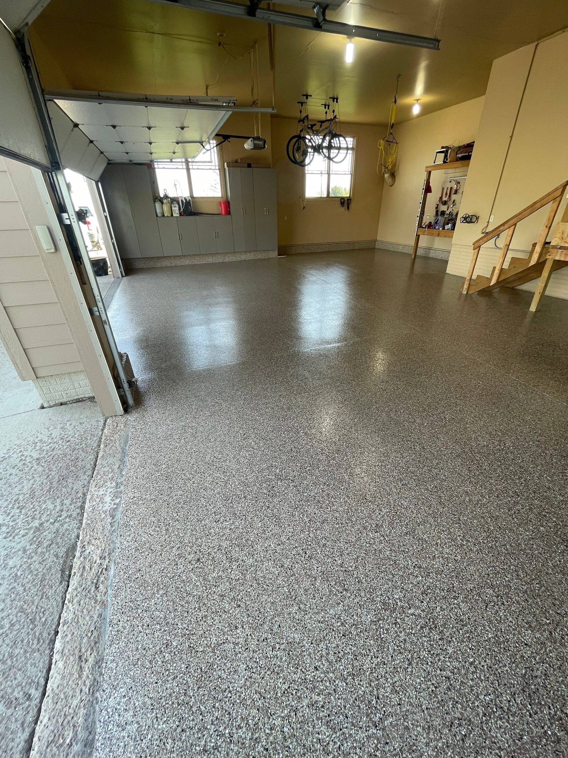 Residential Garage Floor Transformation with Speckled Epoxy Coating by Select Painting, Coatings & Garage Cabinets