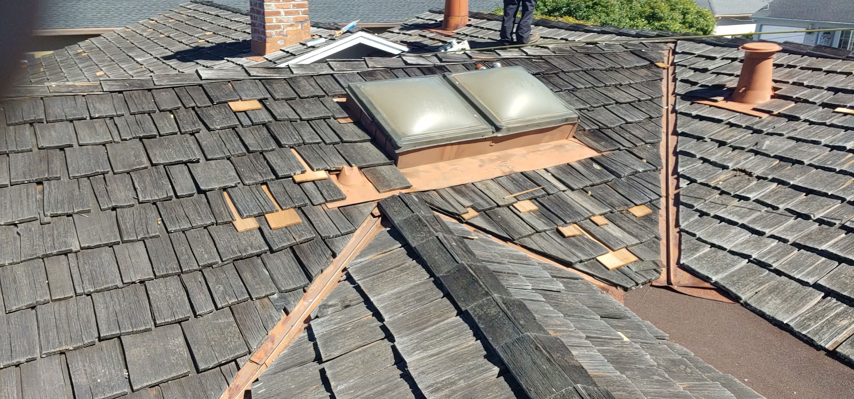 Refurbish and repair shake roof to get ready to sell by Straight Edge Roofing Inc