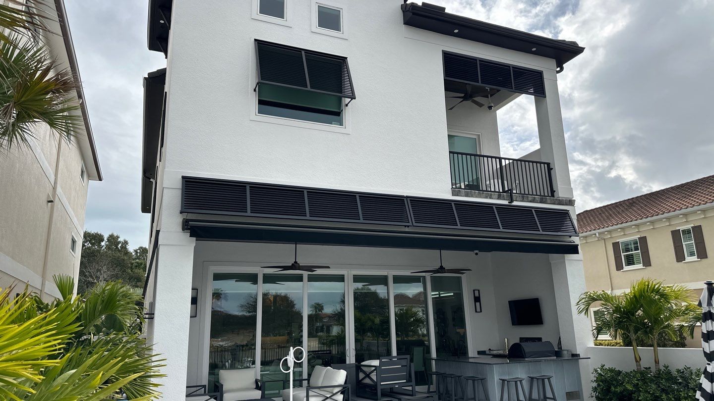 Bahama Shutters in Jet Black by Smart Guard Shutters