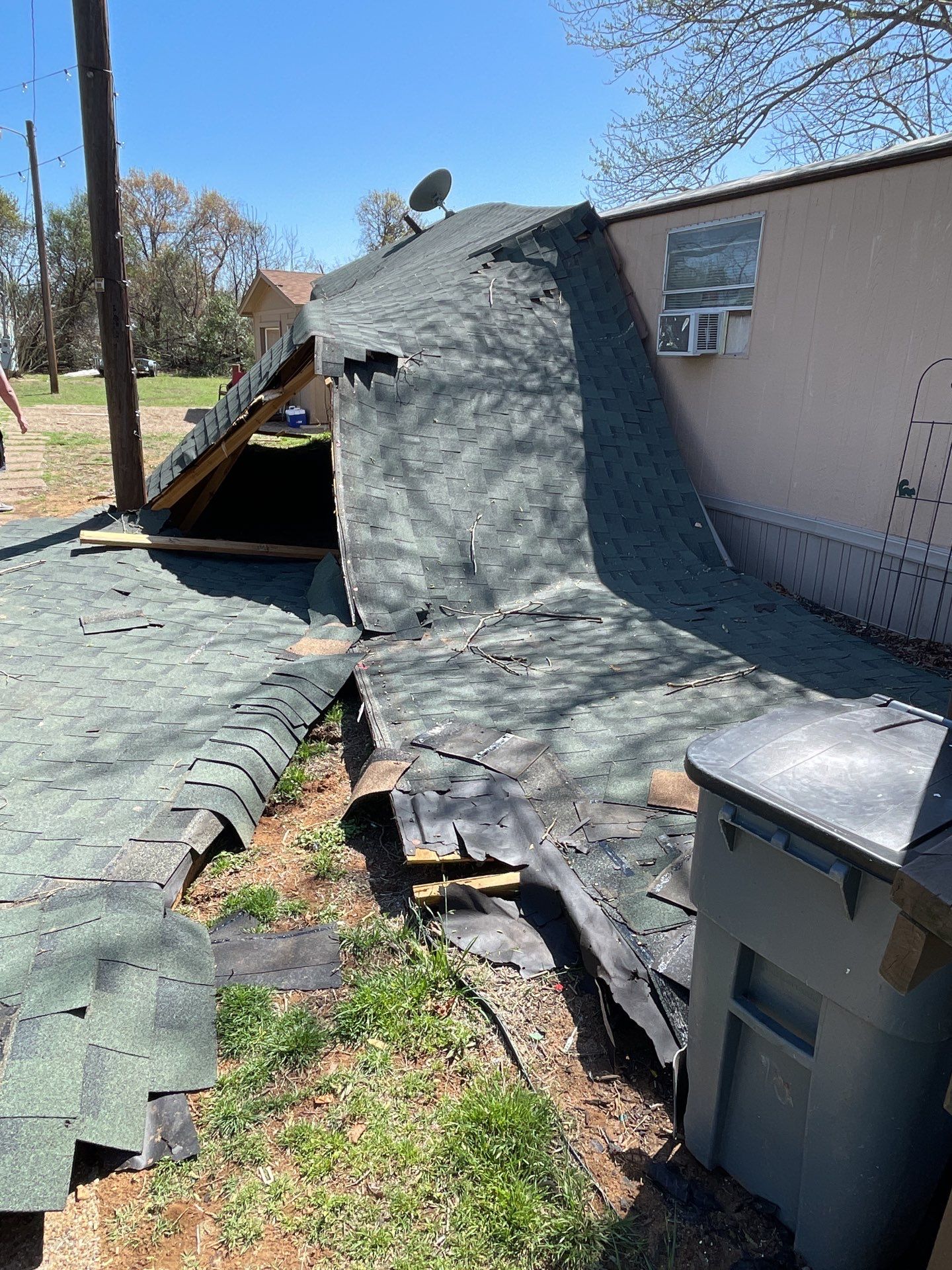 Roof Damage using ATLAS Pinnacle Pristine Shingles by Harvey Roofing & Construction