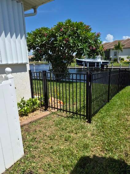 Custom Black Aluminum Fence Enclosure for Punta Gorda Waterfront Property by True Fence LLC