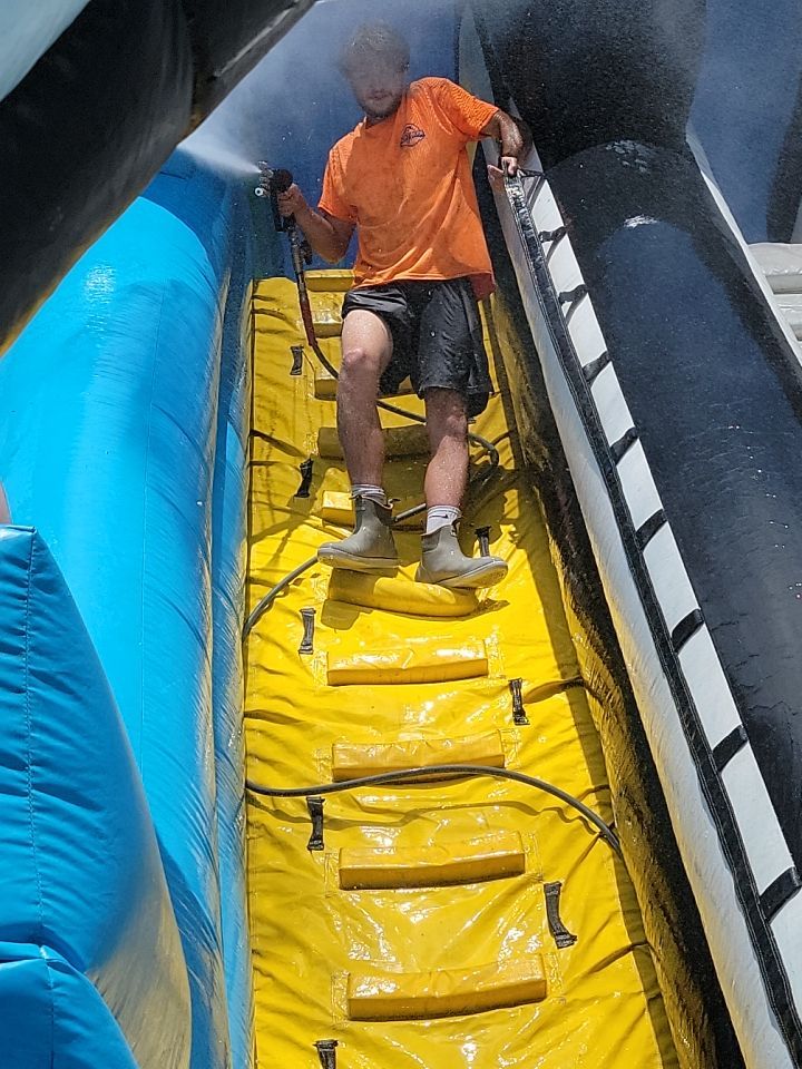 Cleaning for big bounce america prior to a large event by Northern Power Washing LLC.