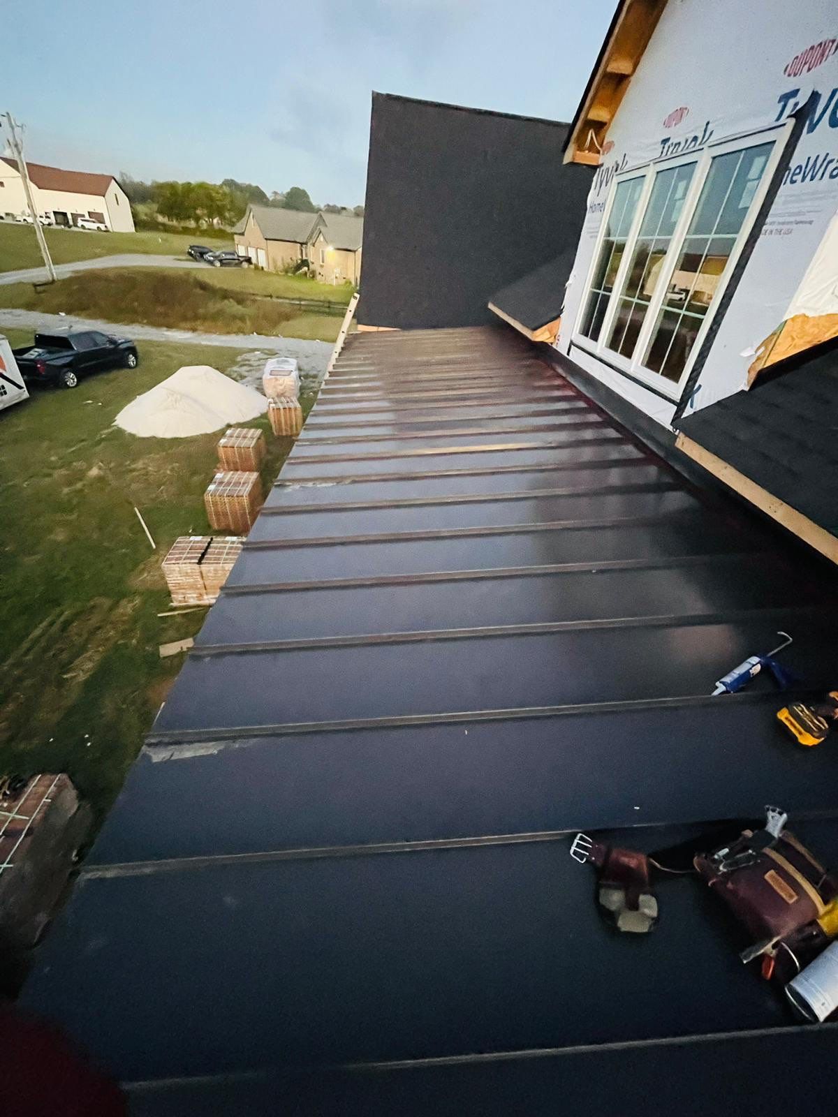 Residential Roofing Installation using Tamko Heritage AR with Standing Seam Metal Porch by Undersun Roofing 