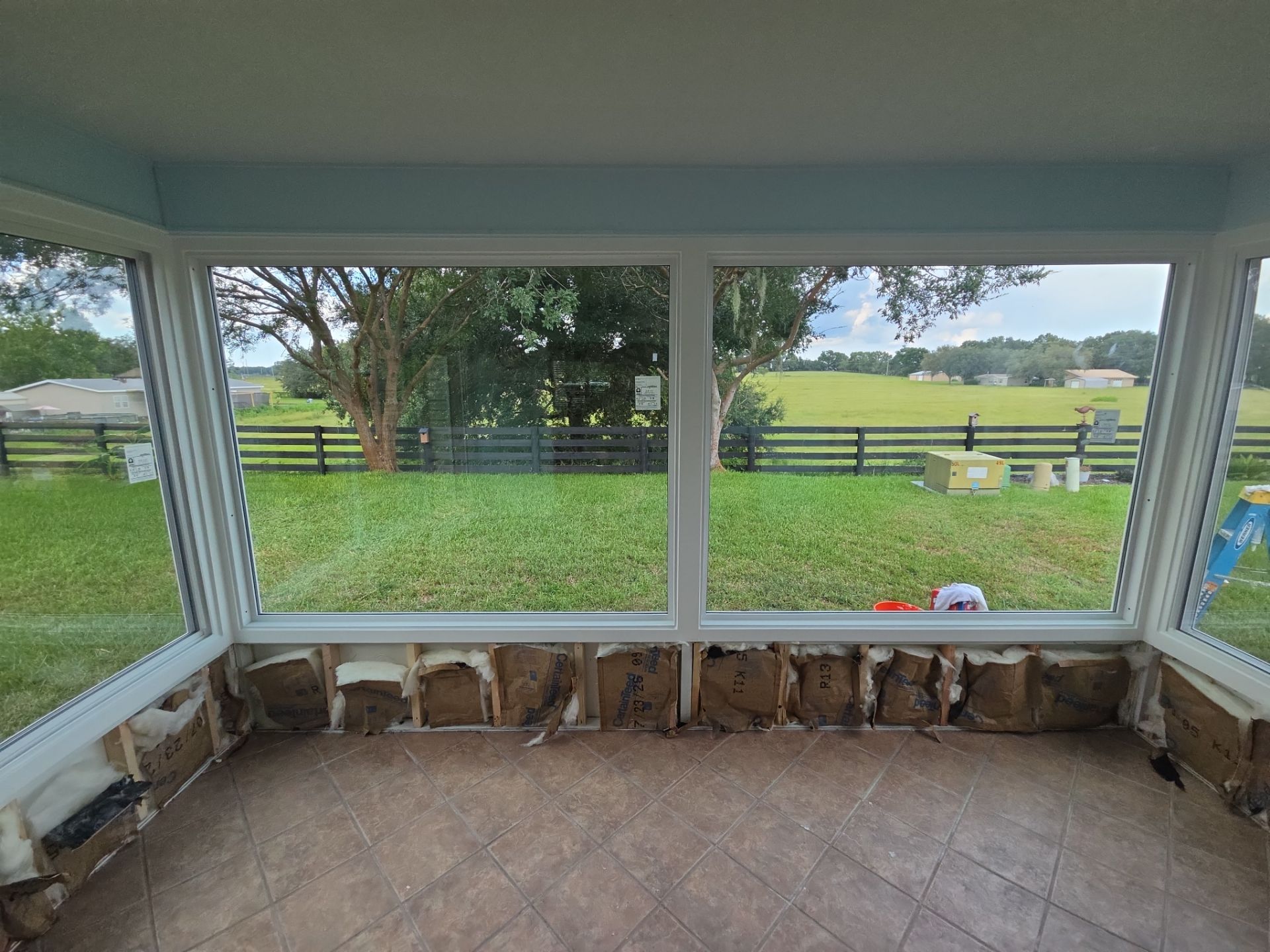 Sunroom Conversion with Alside Windows and Provia Door in The Villages by Windows & Doors Store