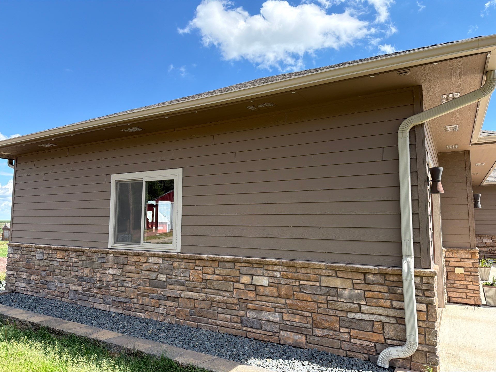 Full Exterior Siding Paint Restoration and Refresh in Garretson by Select Painting, Coatings & Garage Cabinets