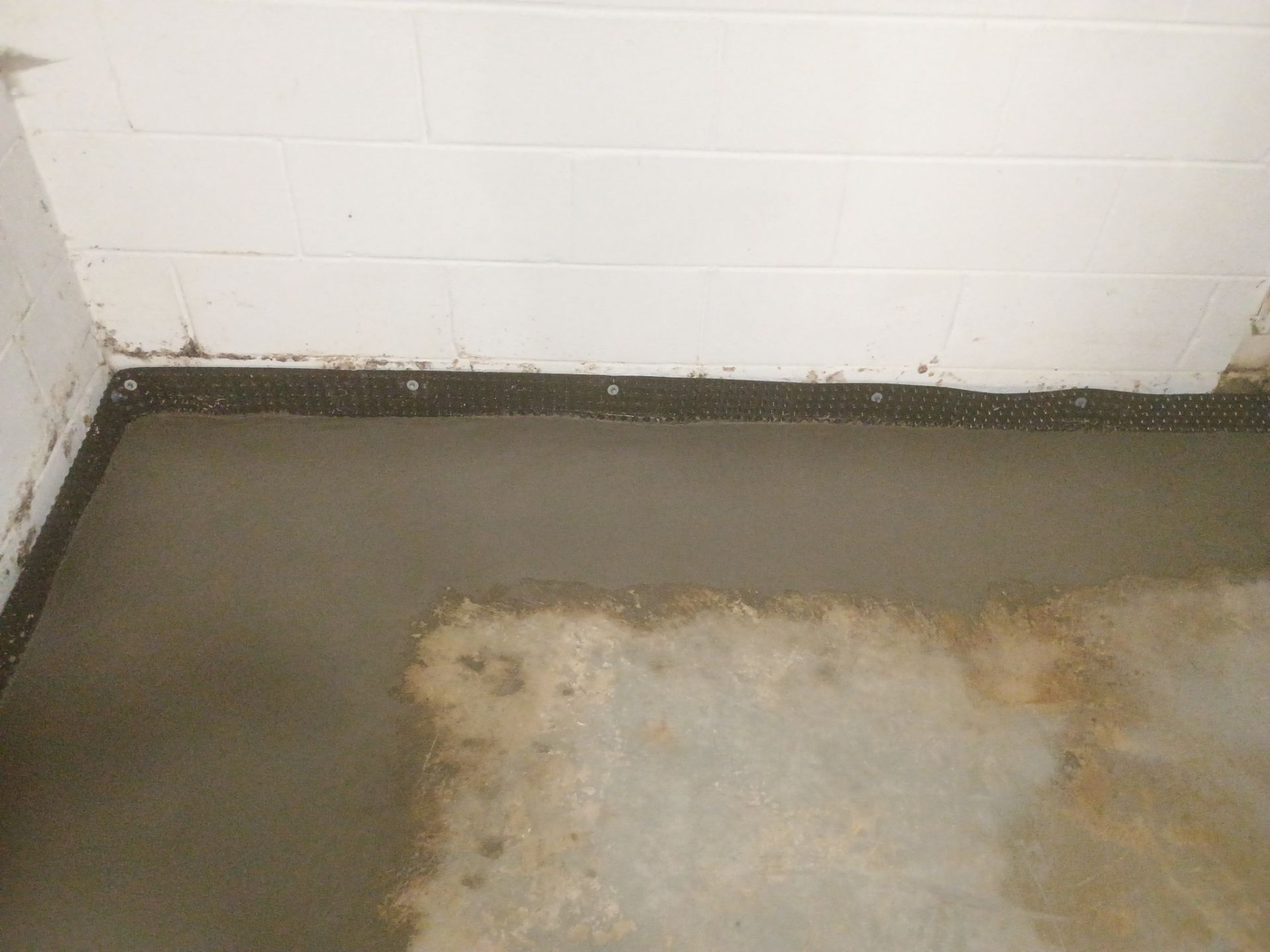 Interior Drain Tile Installation in Columbia Heights, MN by Waterproofing Northeast