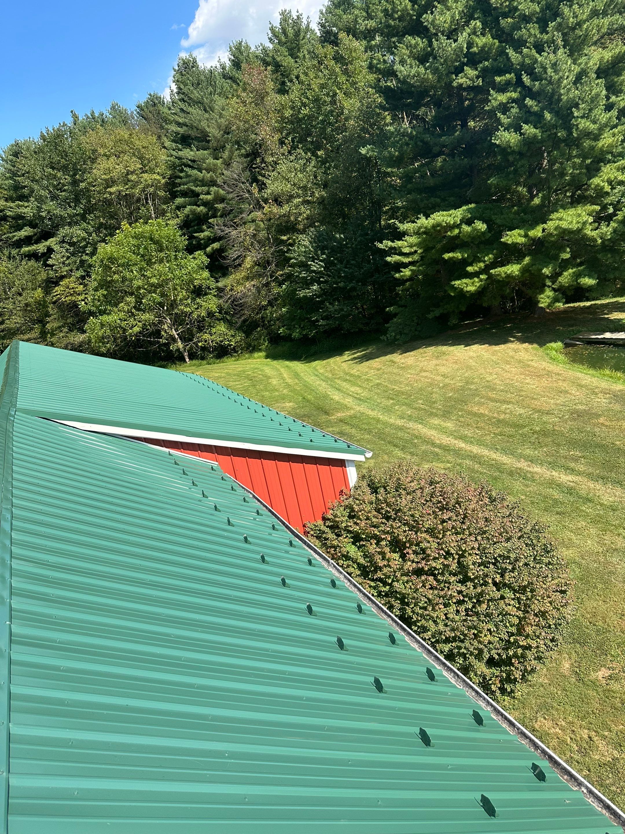 Stunning Metal Roof Transformation on a Classic Red Barn in New Freedom, PA by Bealing Roofing & Exteriors