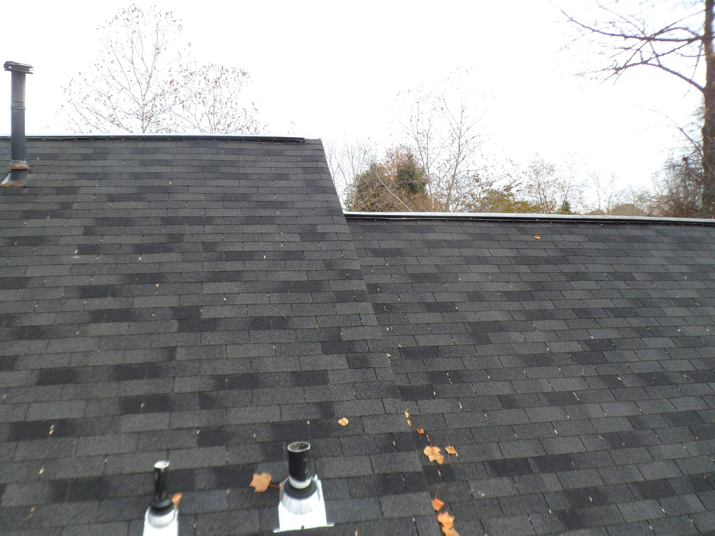 Residential Roofing Installation using Charcoal Black by Alpha Design Services