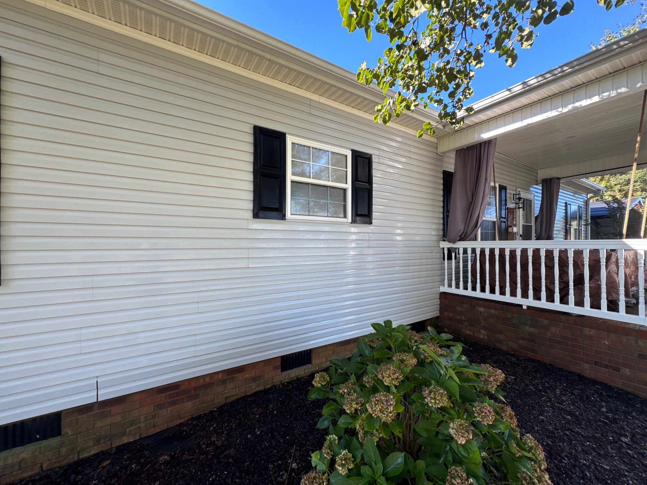 the service involves cleaning the vinyl siding and brick foundation of the house to enhance its appearance and maintain integrity