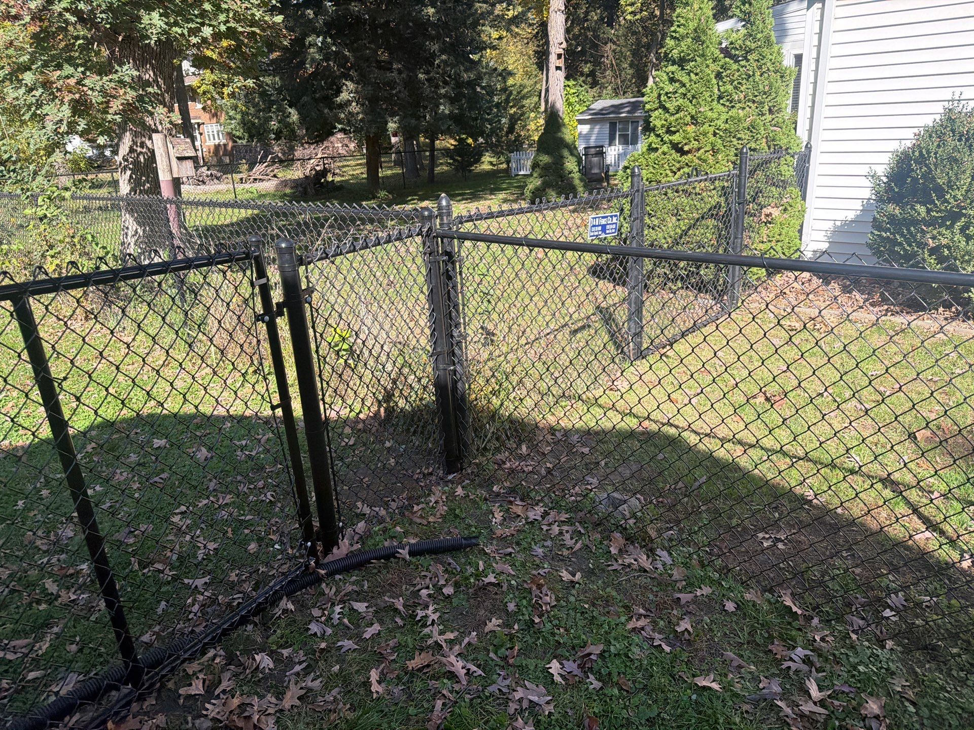 Residential Black Chain Link Fencing in Cedar Falls by Perfect Picket Fence and Stain