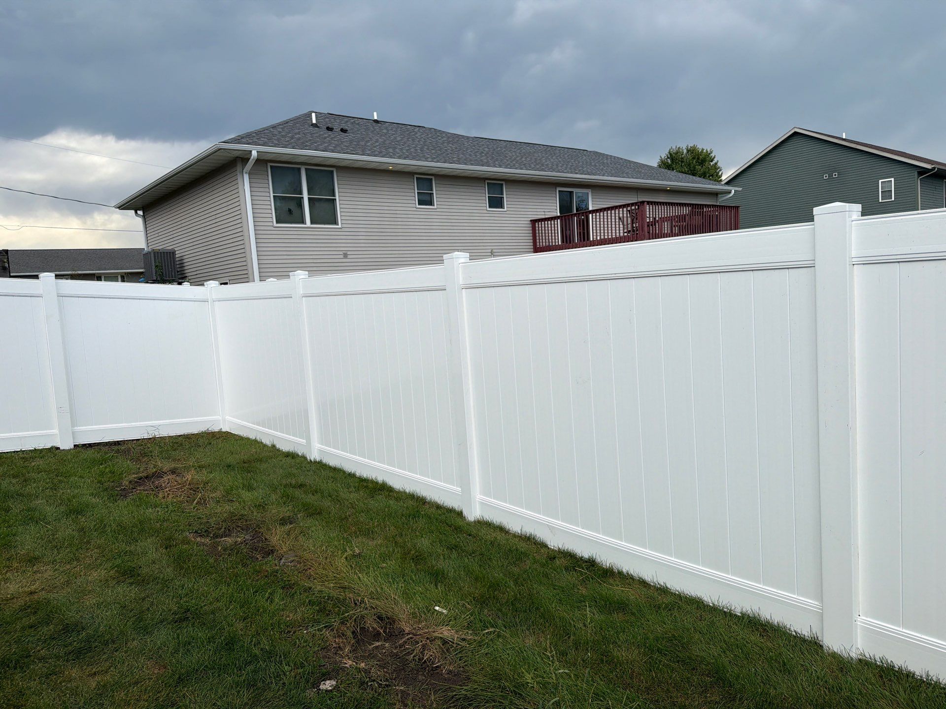 White Vinyl Privacy Fence Installation in Raymond, IA by Perfect Picket Fence and Stain
