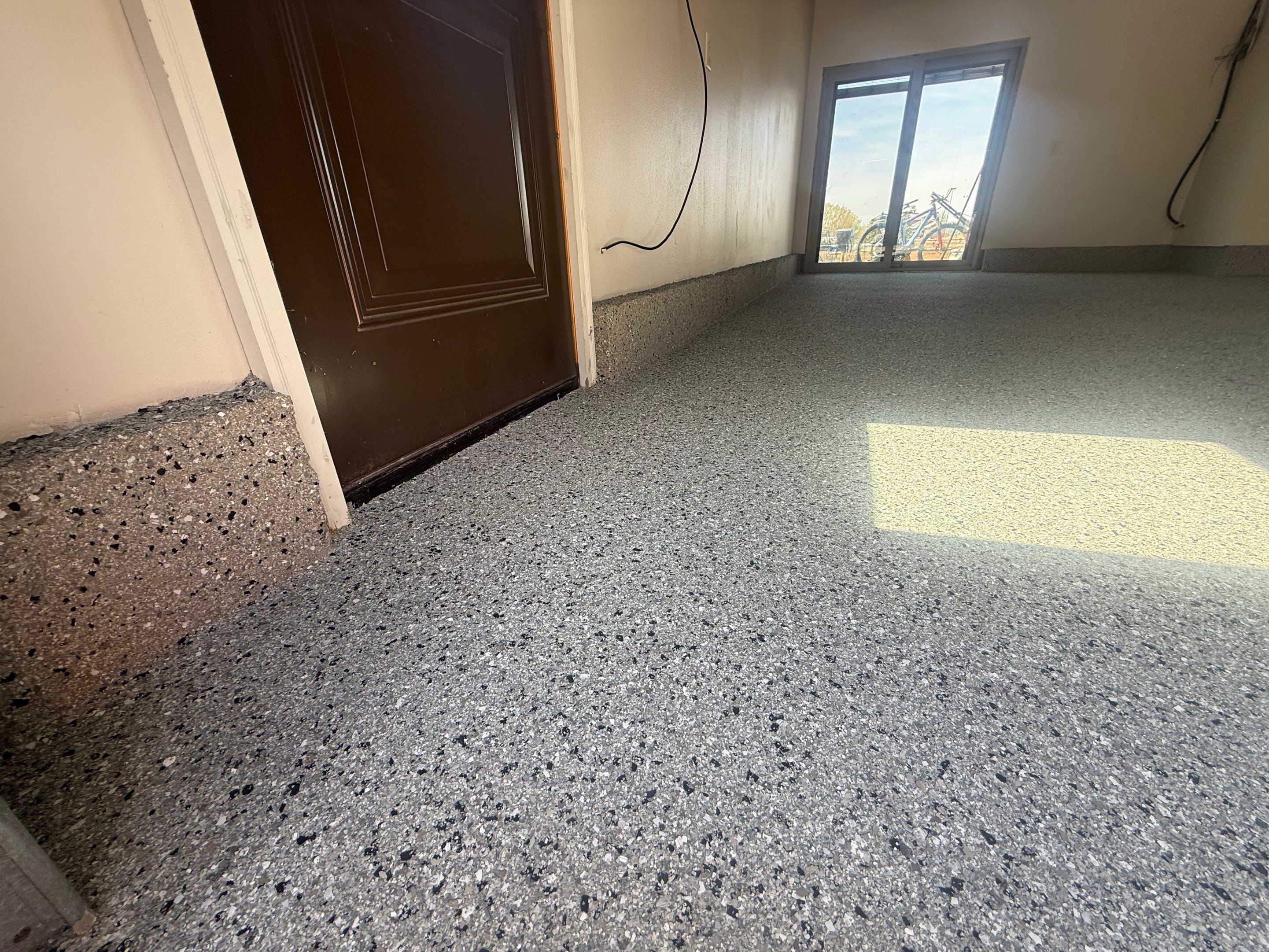 Residential Garage Floor Coating with Grey Speckled Epoxy Finish by Select Painting, Coatings & Garage Cabinets