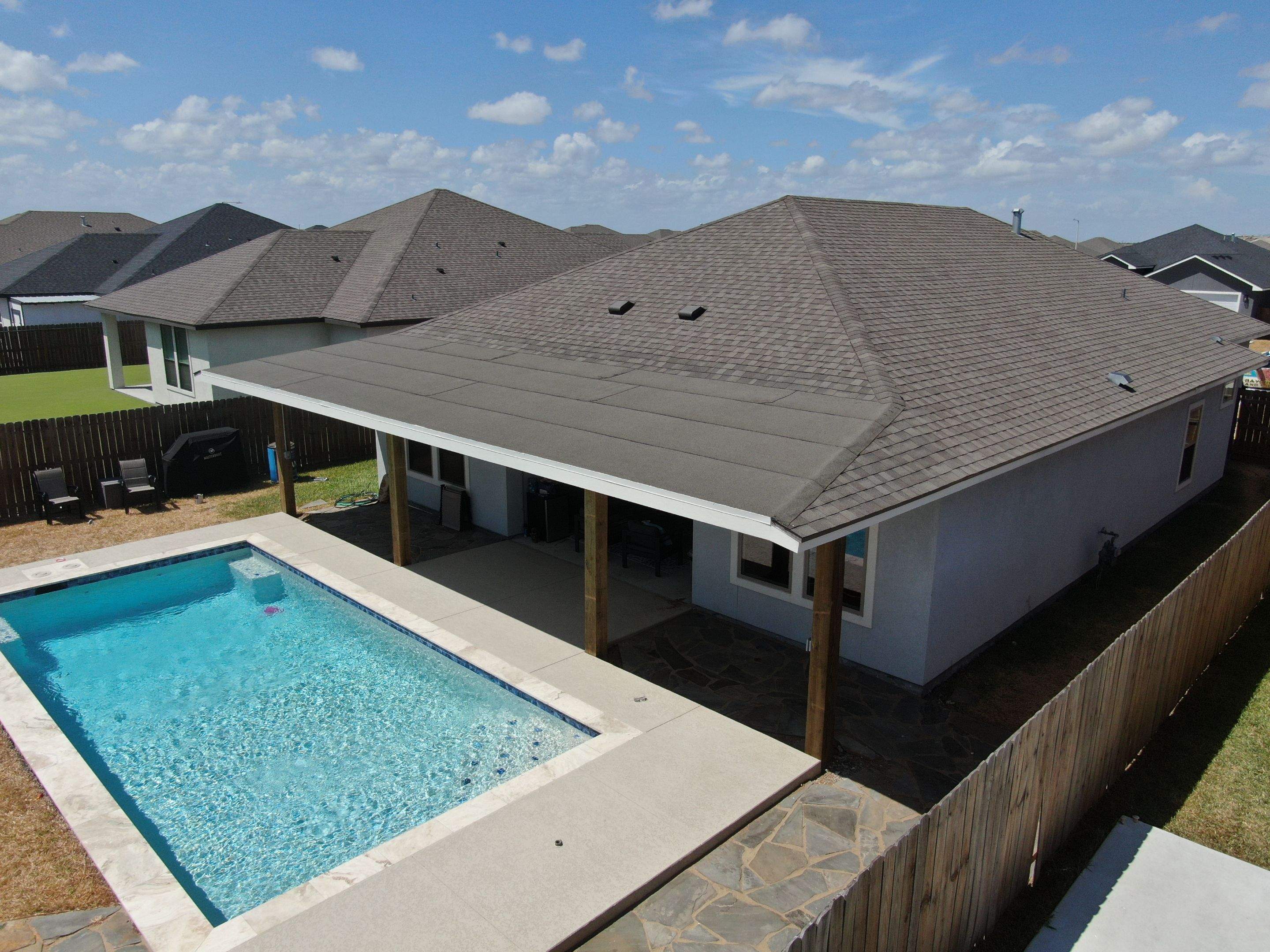 Patio Pool Cover by Bayfront Roofing and Construction