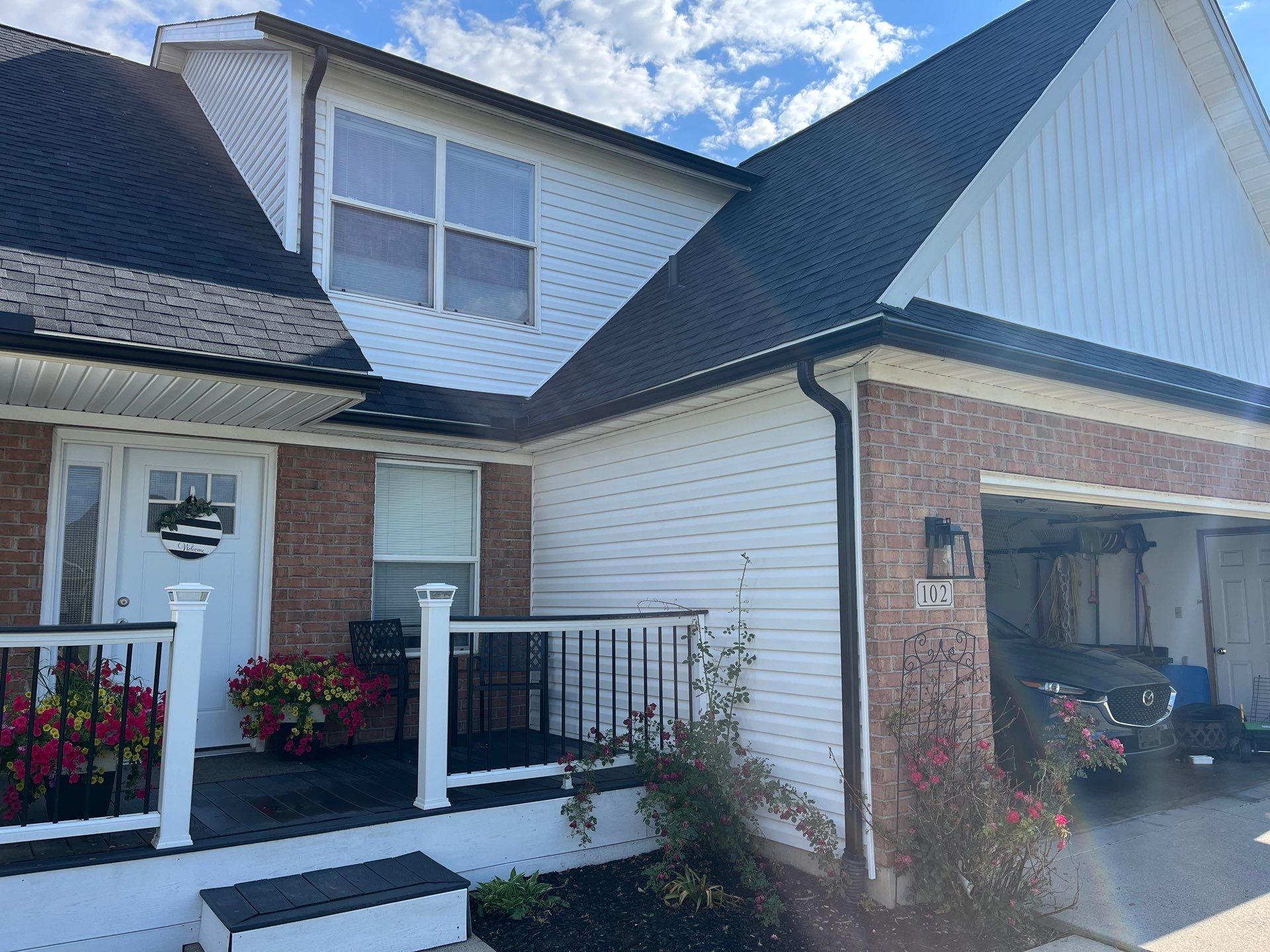 Exterior Installation using Onyx Black Durations and White Siding by WIW Enterprises Inc