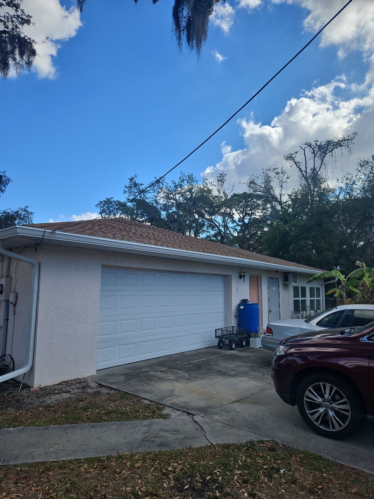 Downspout Installation using White Down Spouts in Sarasota FL by Gutter Professors
