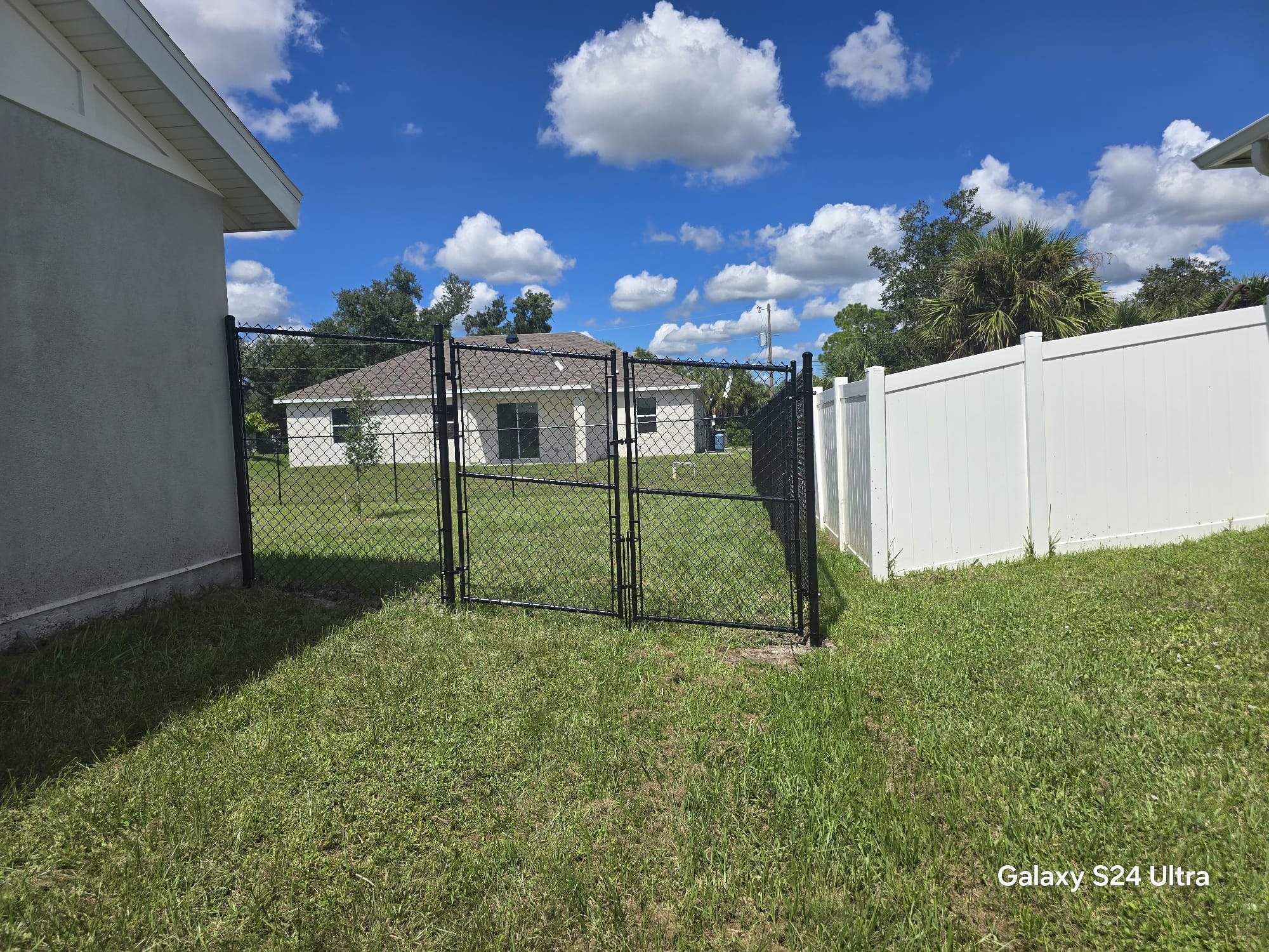 Residential Black Chain Link Fence Installation in North Port by True Fence LLC