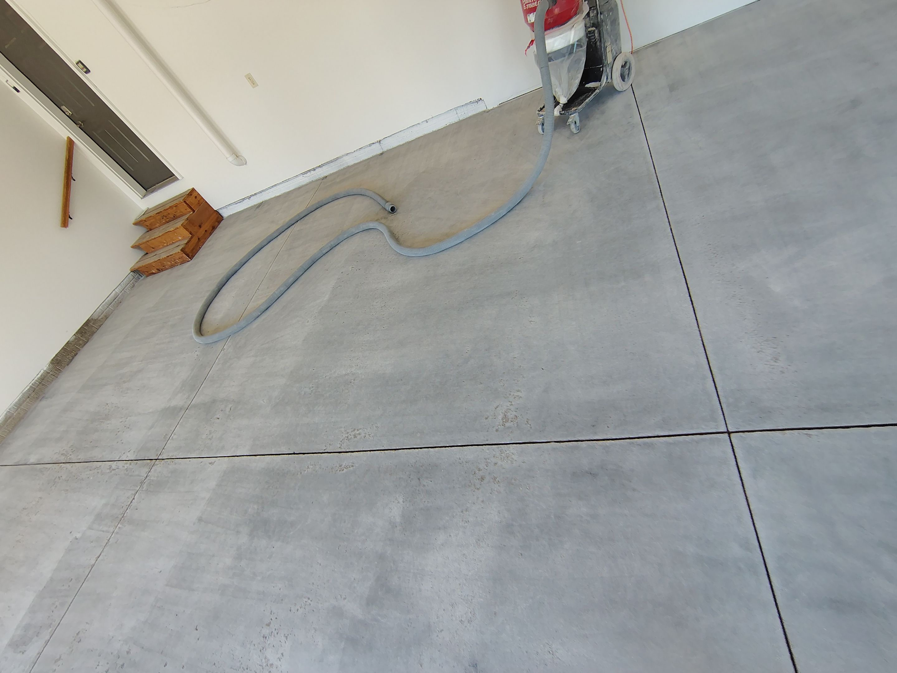 Custom Grey Speckled Epoxy Floor Coating for Sioux Falls Garage by Select Painting, Coatings & Garage Cabinets