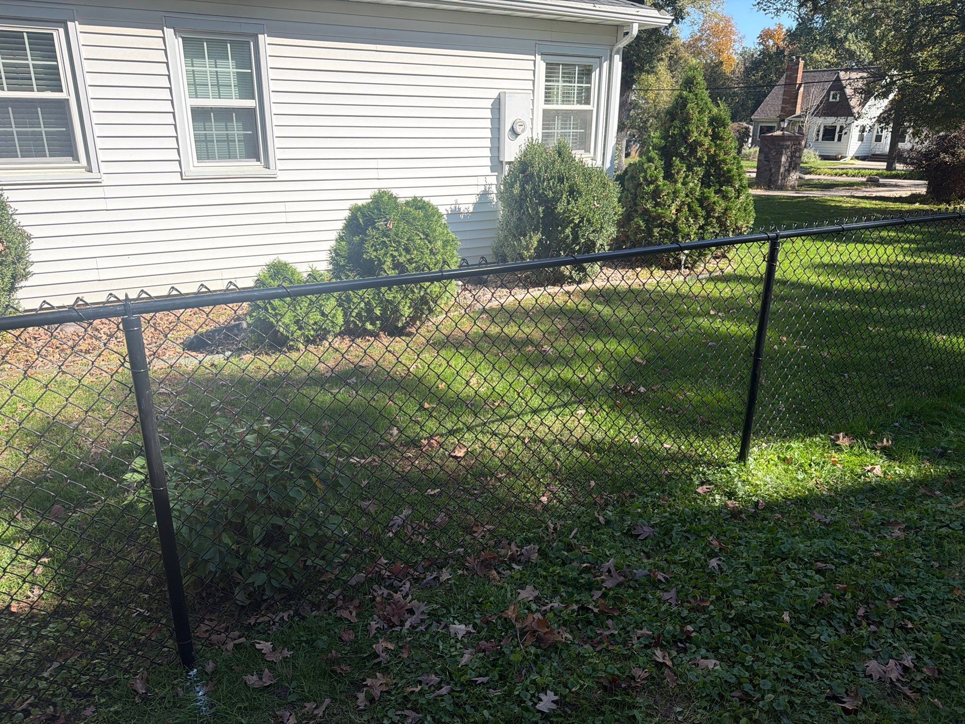 Residential Black Chain Link Fencing in Cedar Falls by Perfect Picket Fence and Stain