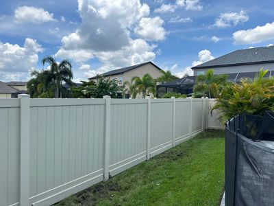 Vinyl Fence Installation using Tan Vinyl Privacy Fence