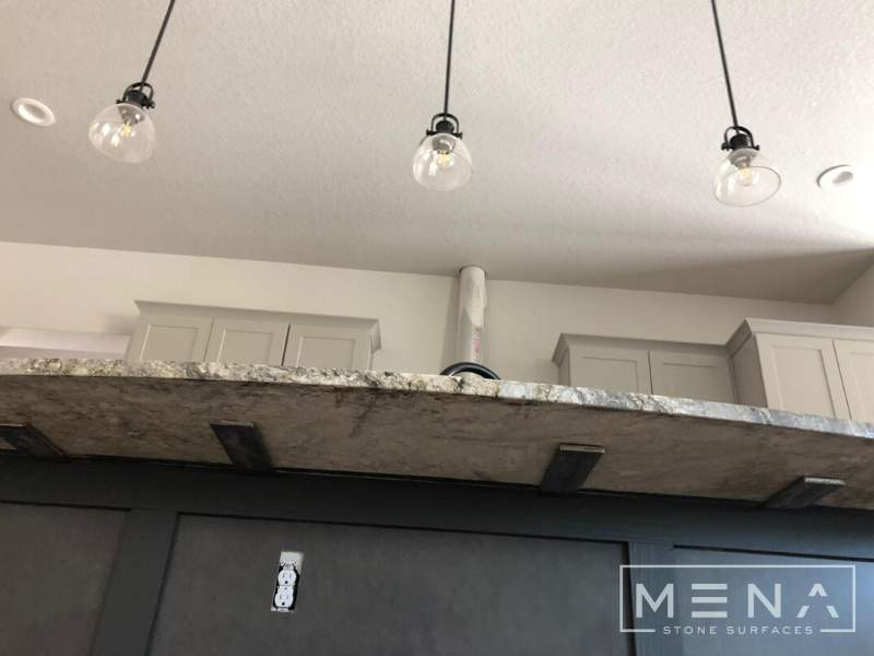 Kitchen countertops using Blue Dunes Granite by Mena stone surfaces
