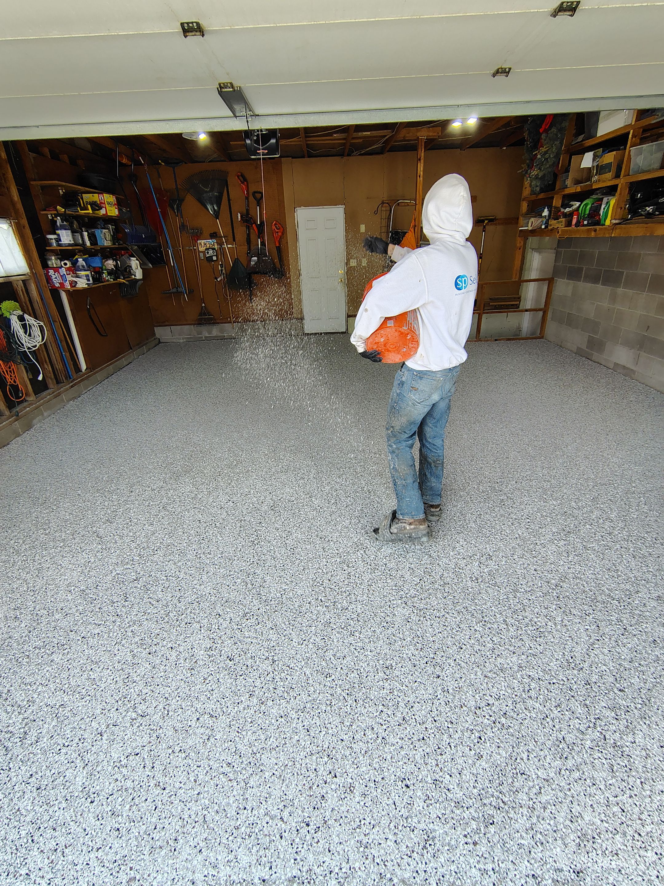 Sioux Falls Garage Epoxy Floor Installation and Concrete Crack Repair by Select Painting, Coatings & Garage Cabinets