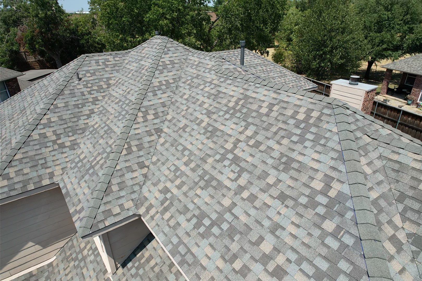 Red brick/white stone with IKO Cornerstone by Tejas Roofworks + Restoration