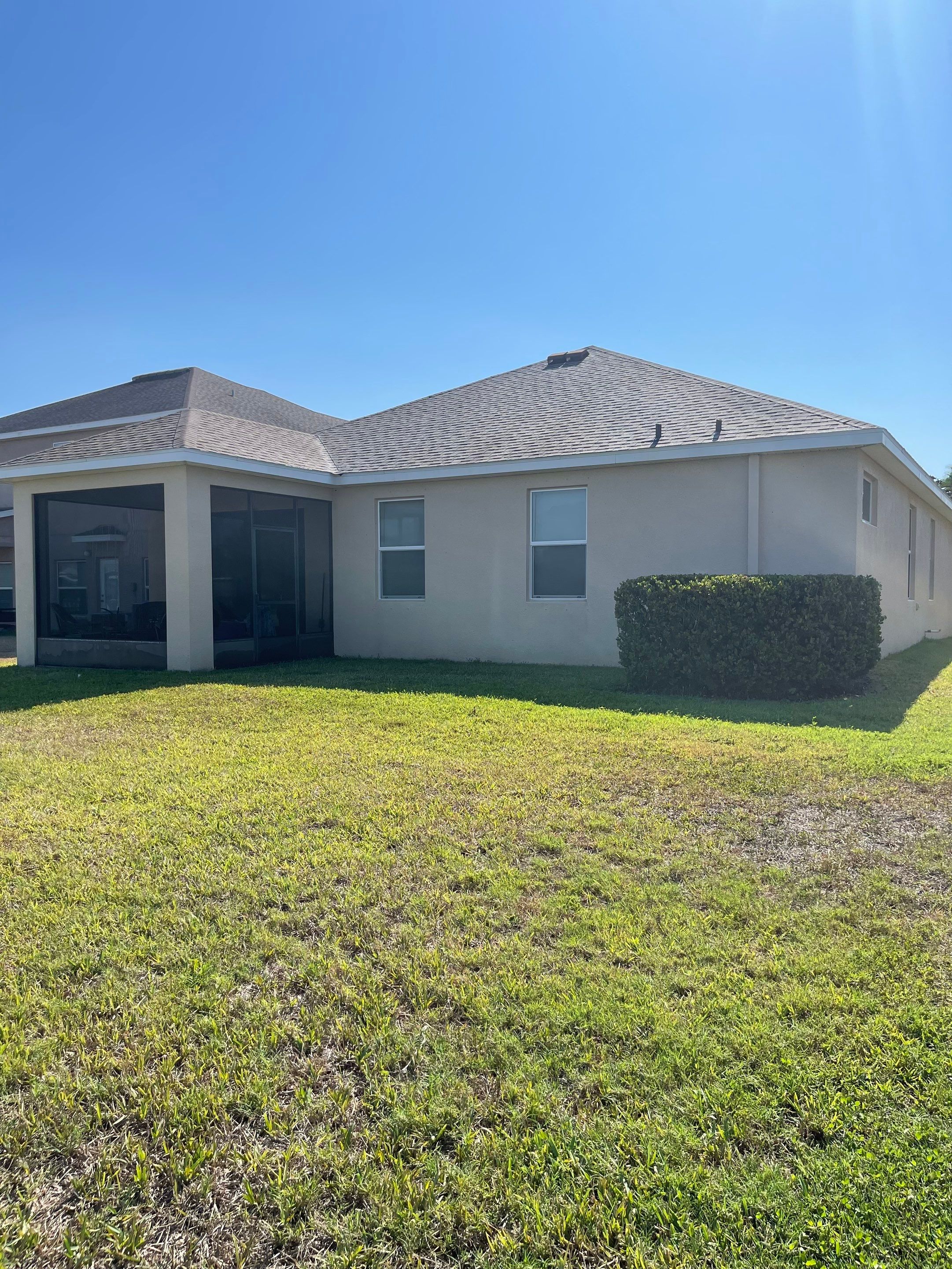 Asphalt Shingle Roof Soft Wash Cleaning & Concrete Pressure Washing in CopperStone Community, Parrish, FL by Sunshine AquaWash