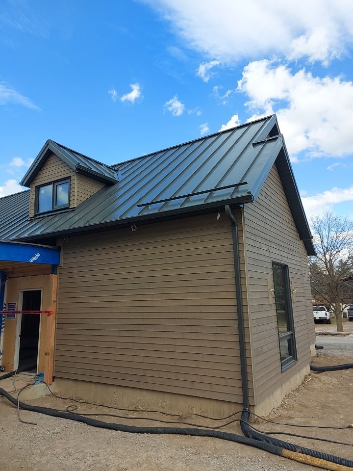 New Home Construction using 16" Standing Seam Panels by Jay Carter Roofing & Sheet Metal