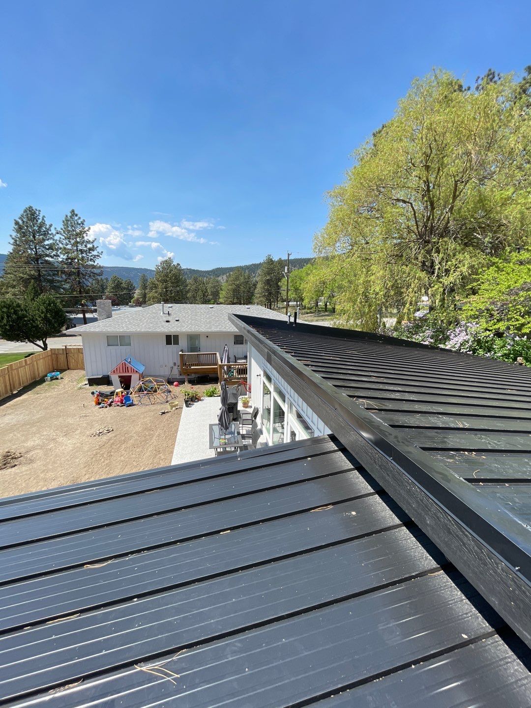 Residential Roofing Installation using 12" Prolok metal  by Top Notch Roofing Inc