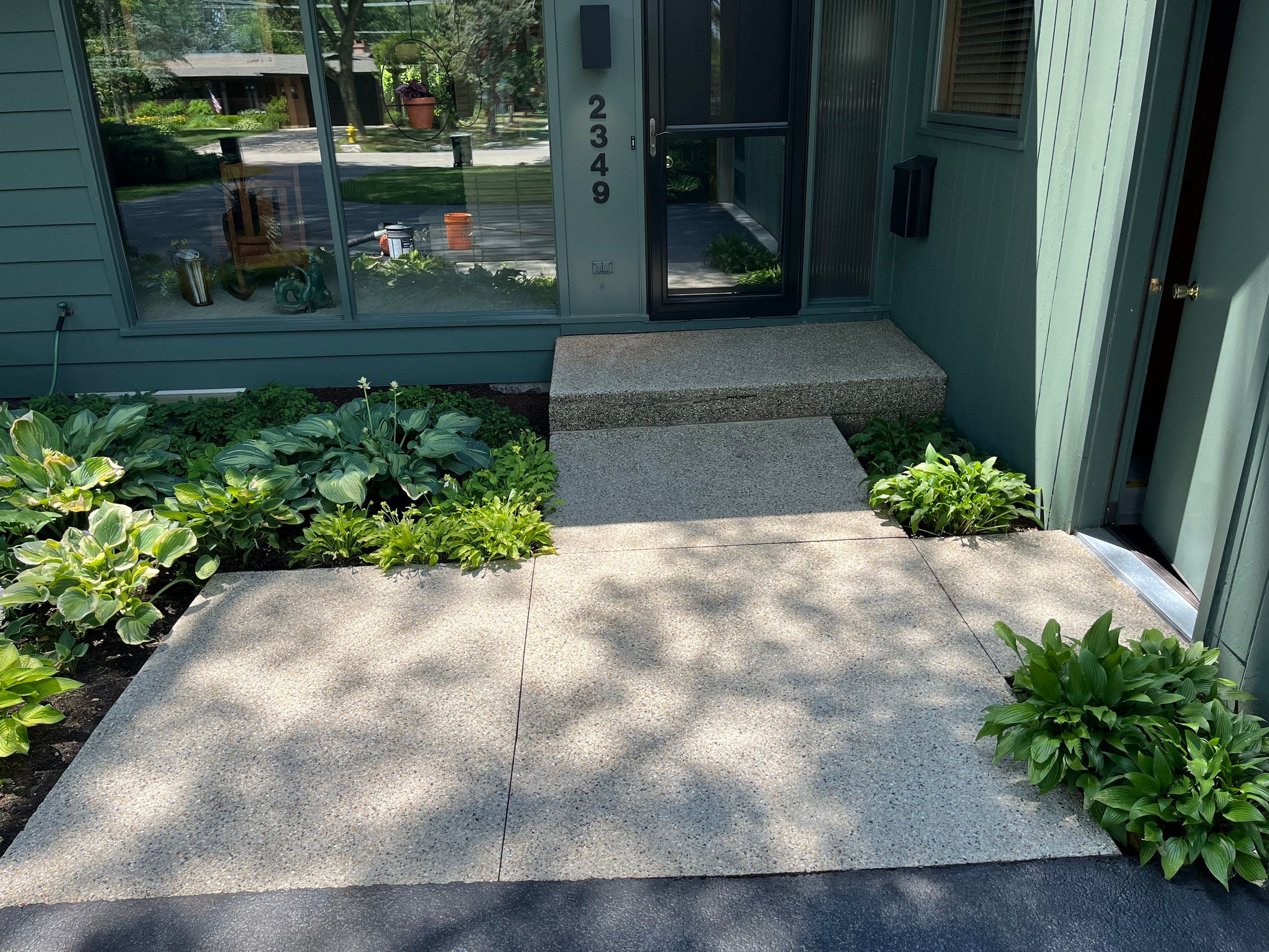 Aggregate concrete cleaning and sealing using Surebond SB-9000 by Northern Power Washing LLC.