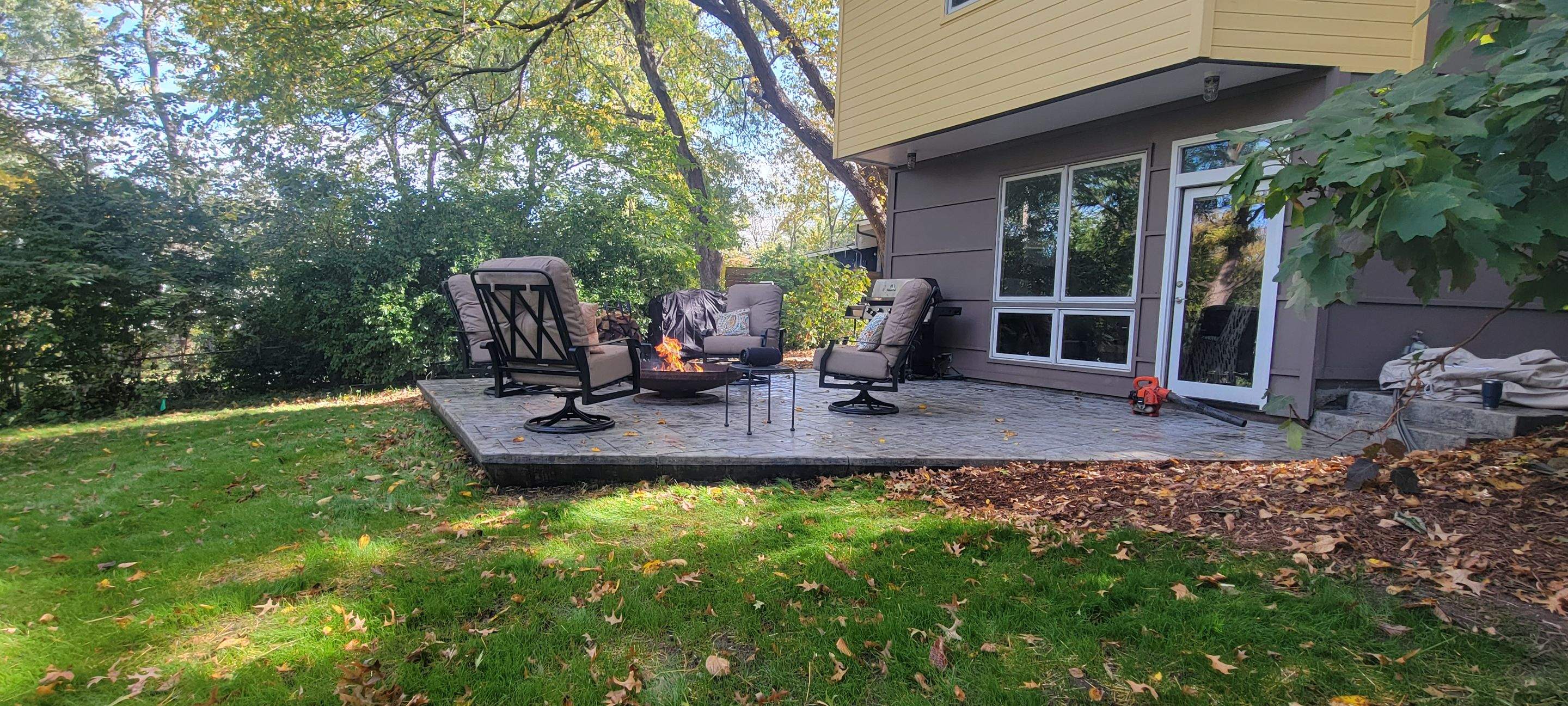 Back Yard Cantilivered Patio by LAND ESCAPES LLC
