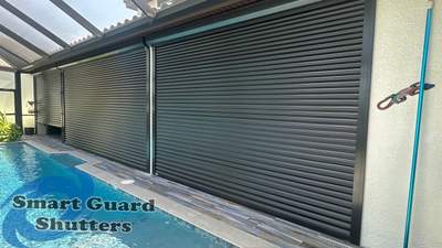 Motorized Rolling Shutter In Bronze