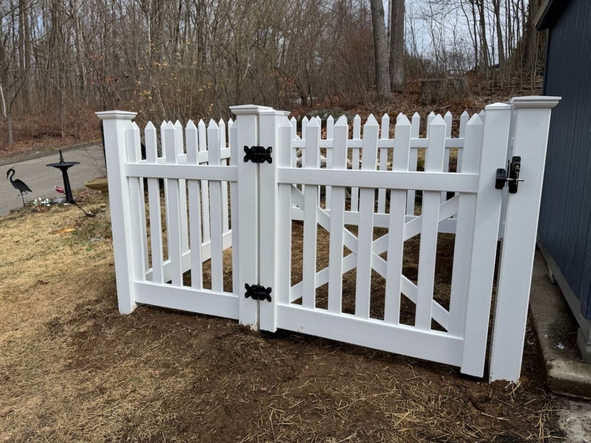 New White Vinyl picket fence with matching gate by DiGiorgi Roofing and Siding Inc