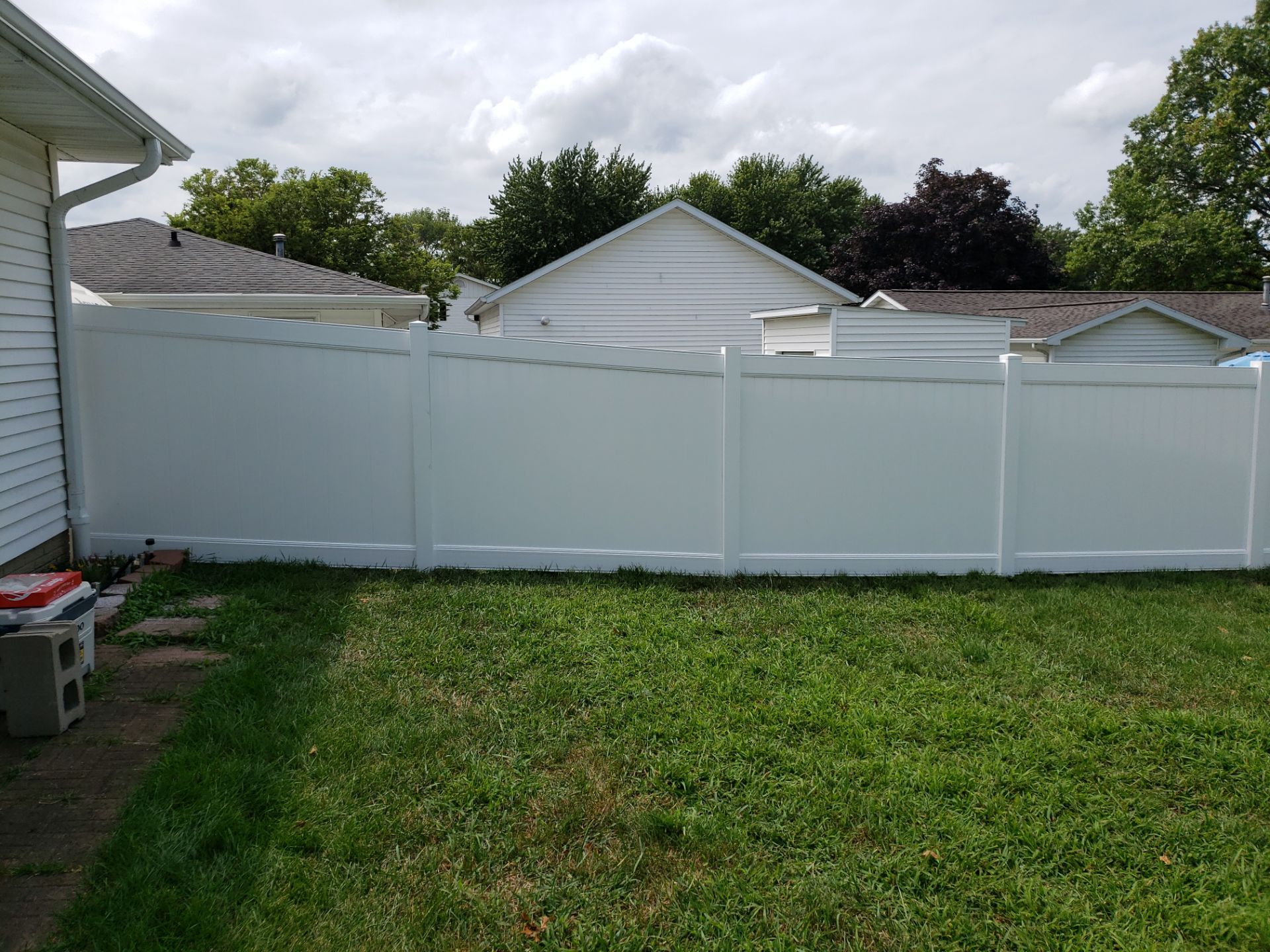 White Vinyl Privacy Fence Installation in Grundy Center by Perfect Picket Fence and Stain