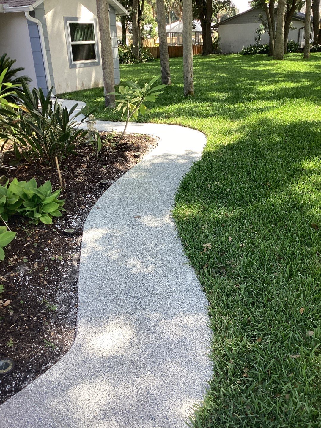 Driveway and Garage using Tidal Wave by Amvet concrete coatings llc