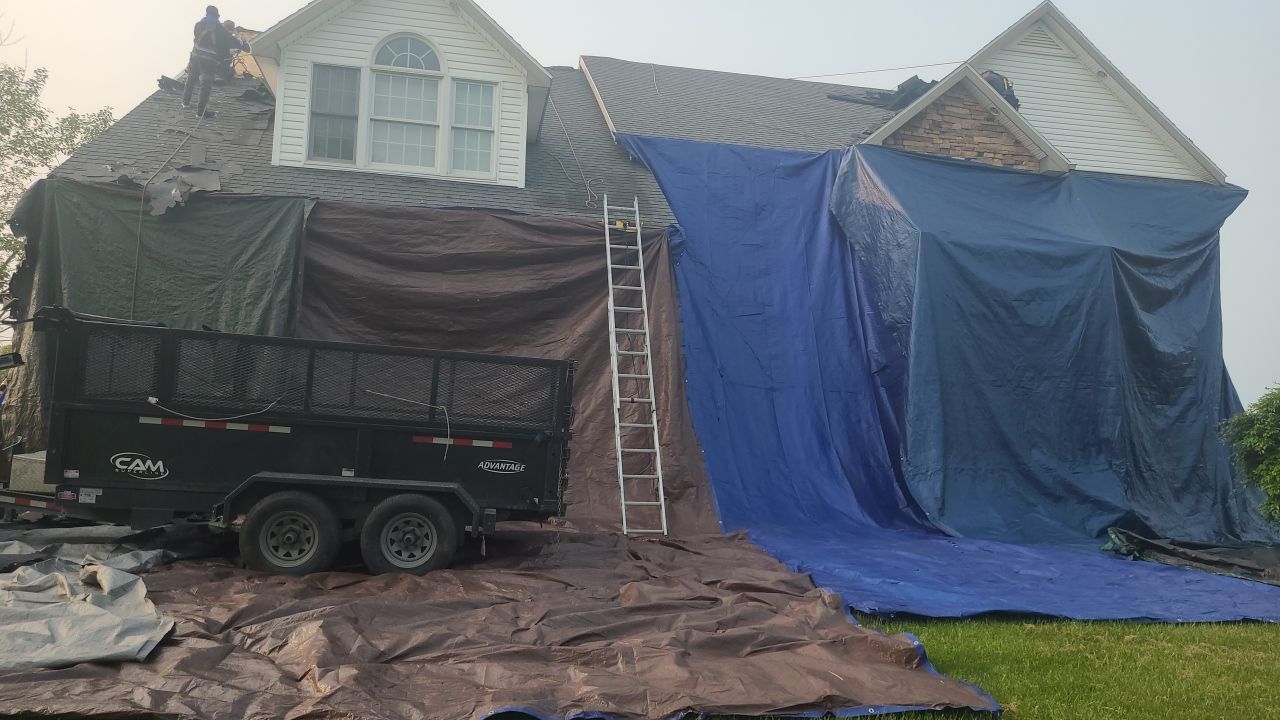 Roof Damage using Certainteed Lifetime Roofing System- Moire Black Landmark Pro shingkes with shadow ridge caps. by BulletpROOF Exteriors