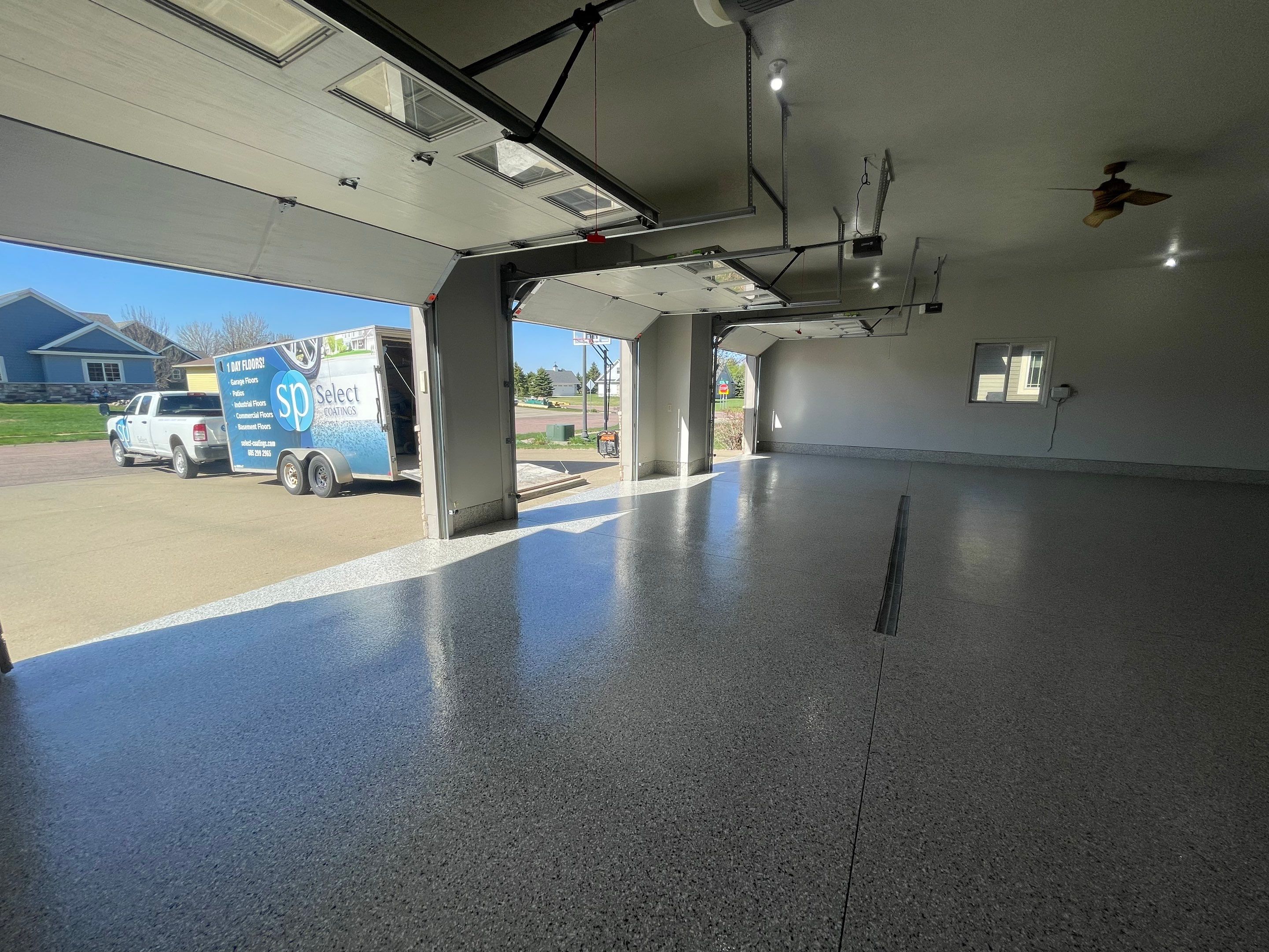Multi-Car Garage Epoxy Floor Coating in Beresford by Select Painting, Coatings & Garage Cabinets