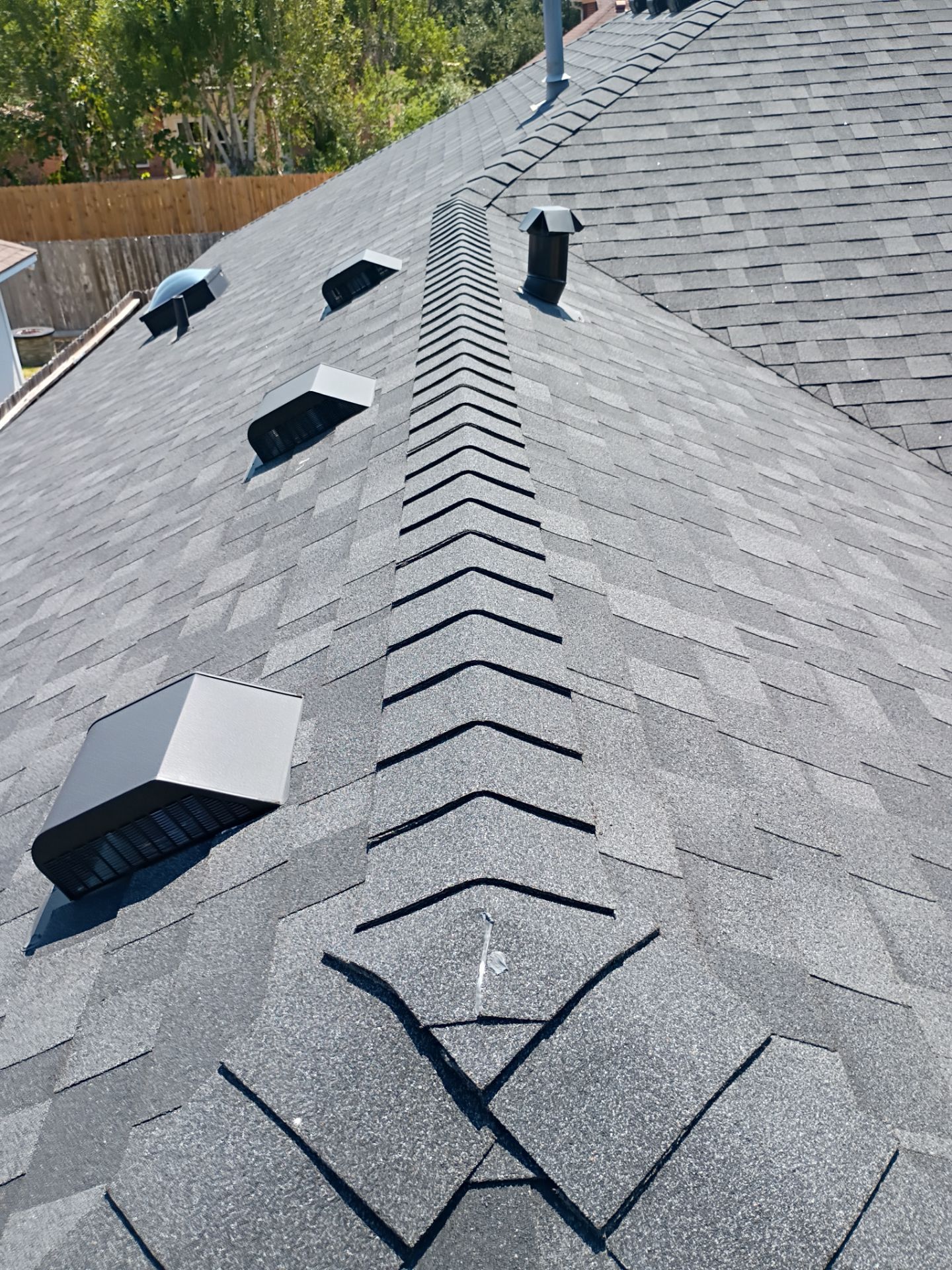 Nothing looks nicer than a little black roof by Bayfront Roofing and Construction