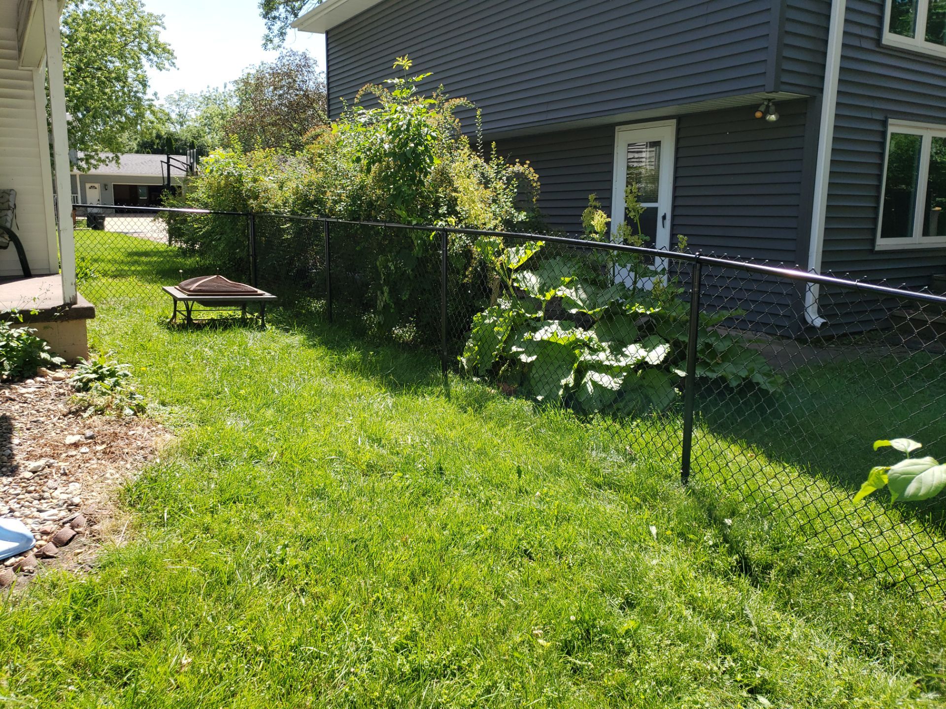 Black Chain Link Perimeter Fence and Gate Installation in Cedar Falls by Perfect Picket Fence and Stain