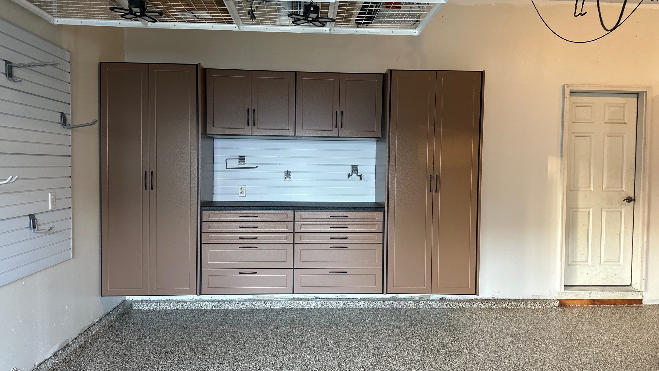 Jake P upgraded his garage with brand new cabinets and a new floor  by Banner Garage