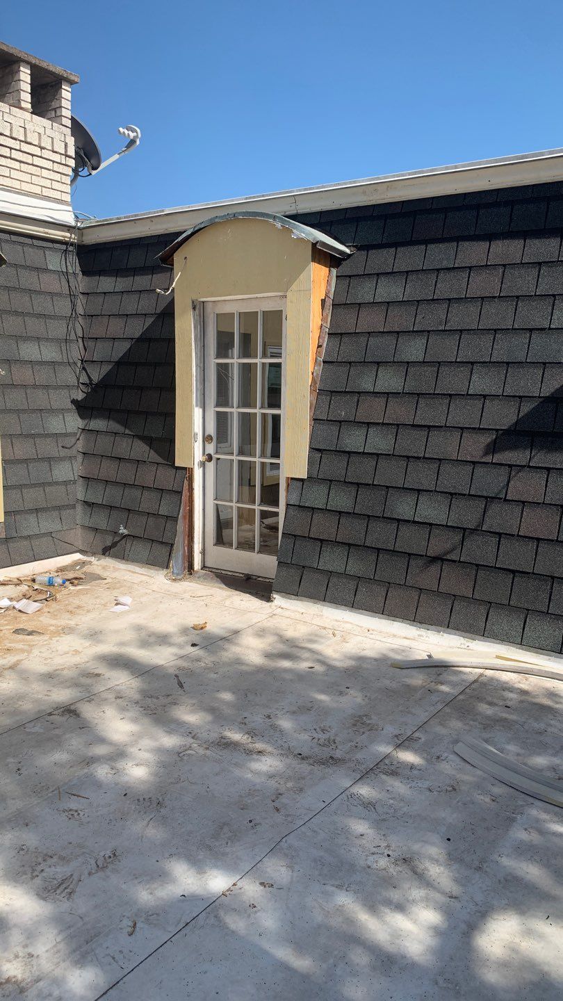 Mansard Charm by Bayfront Roofing and Construction
