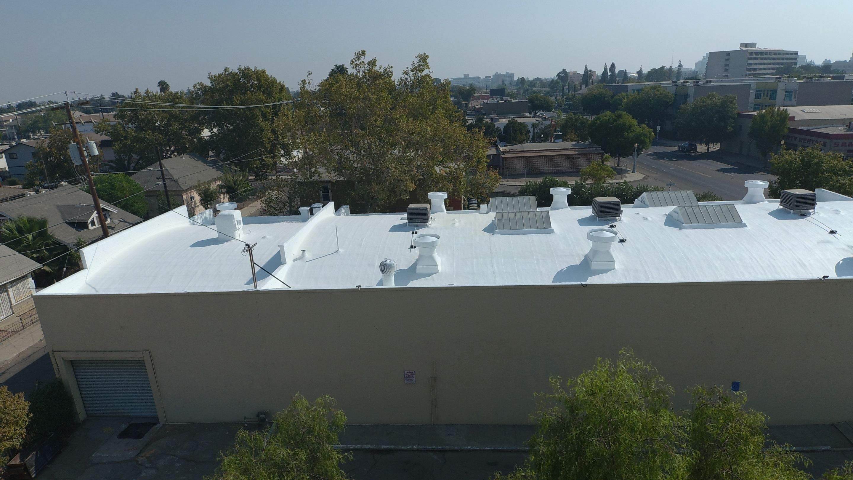 Polyurethane foam roof refurbish and recoating by Straight Edge Roofing Inc