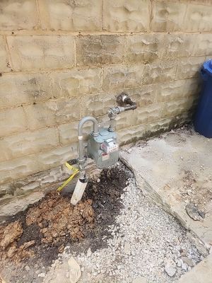 Replace failed gas line from gas connection at street to new meter