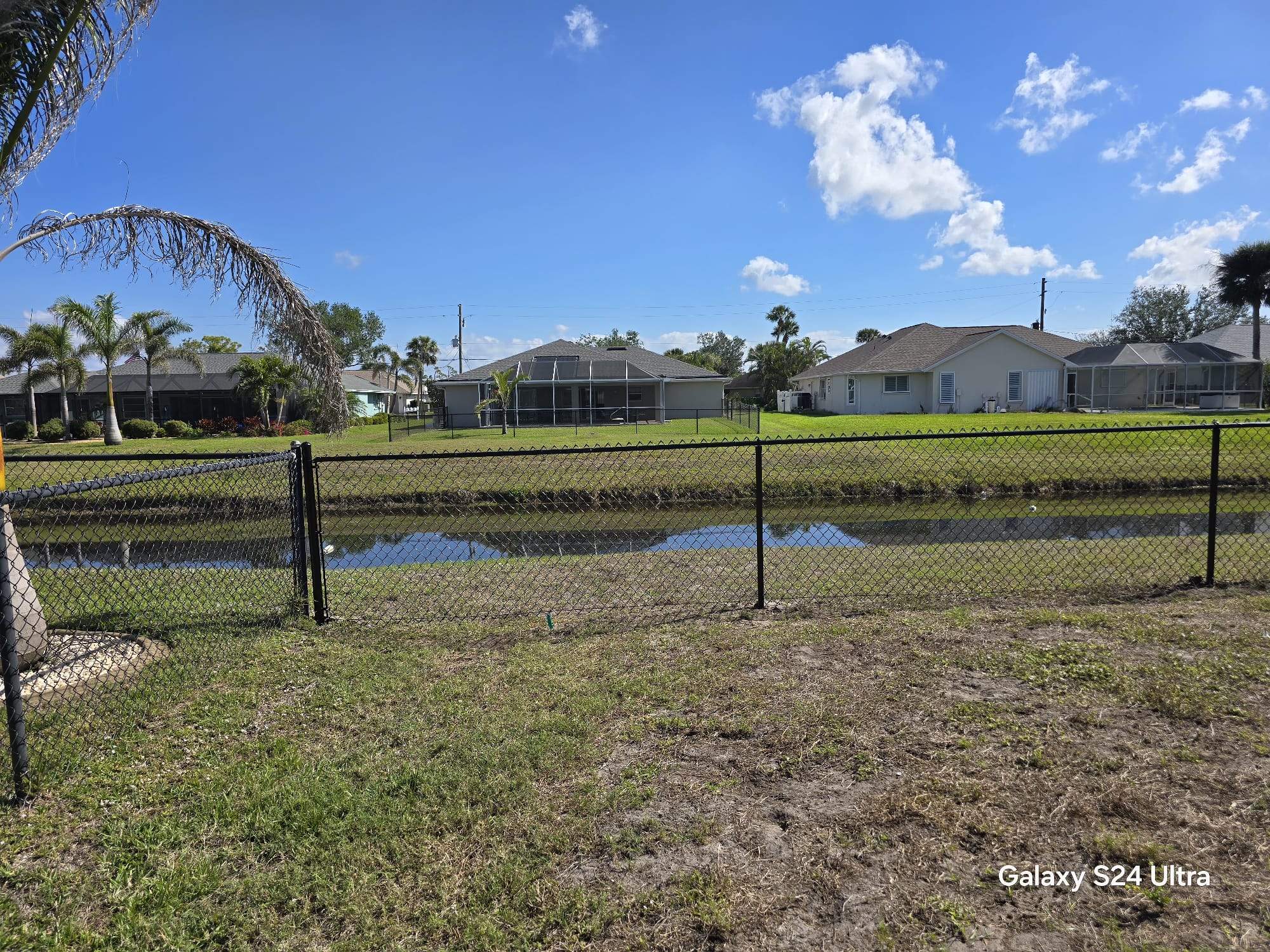 Waterfront Black Chain Link Fence Installation in Rotonda West by True Fence LLC