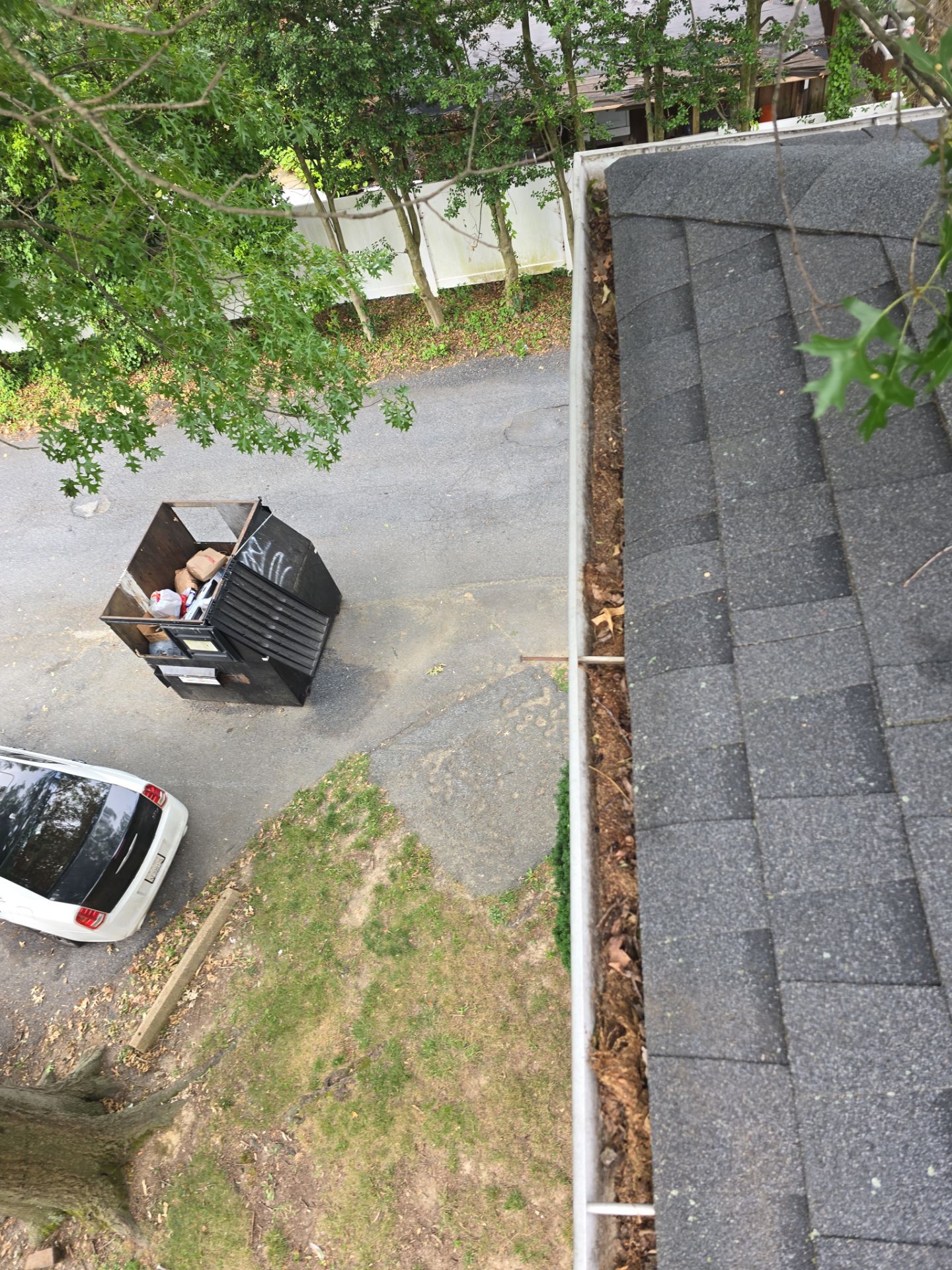 Commercial gutter cleaning Wilmington before photo with filled gutters