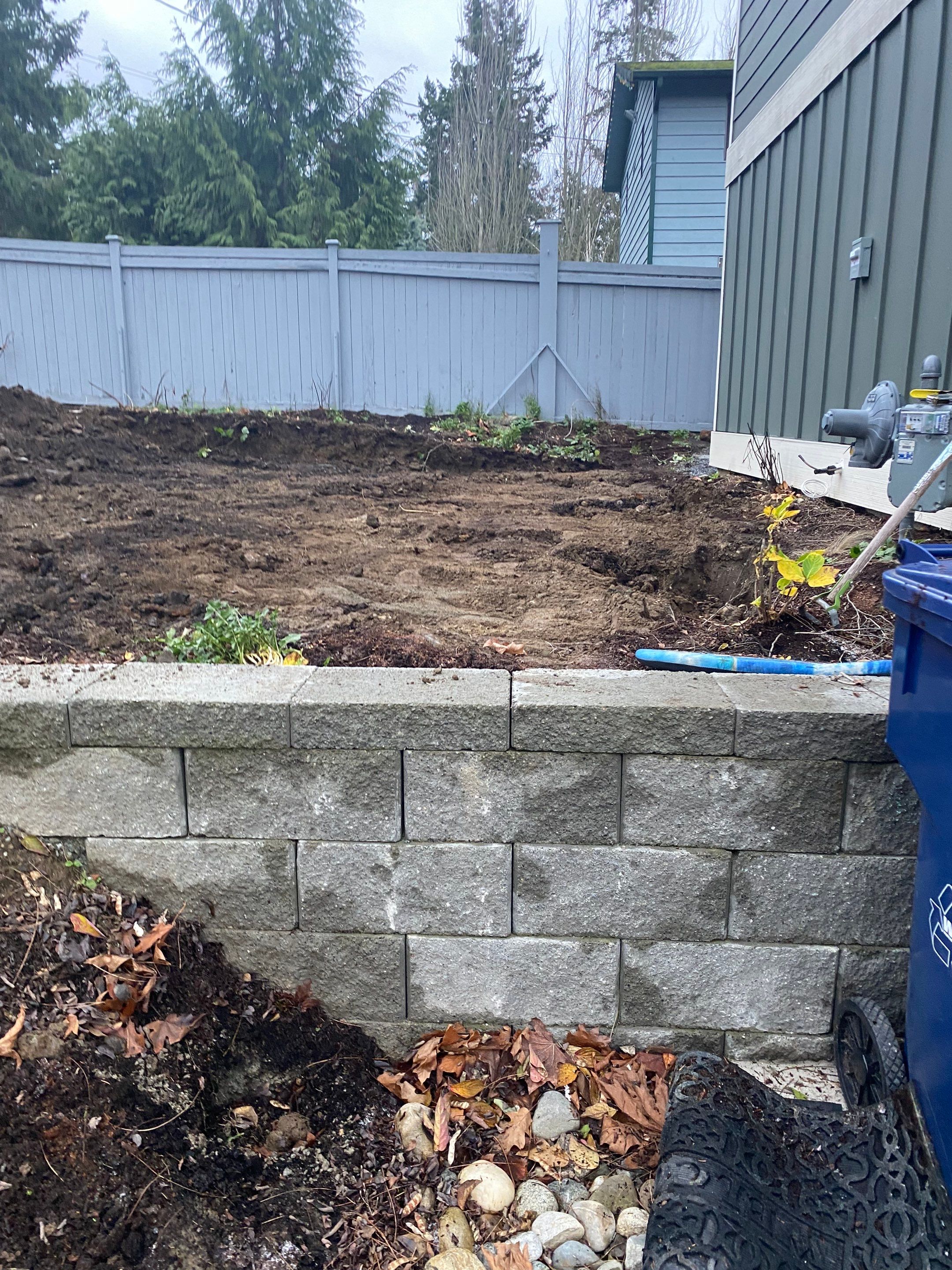 Patio Installation using Concrete, Retaining walls, and Turf install by Jireh Asphalt & Concrete Inc 