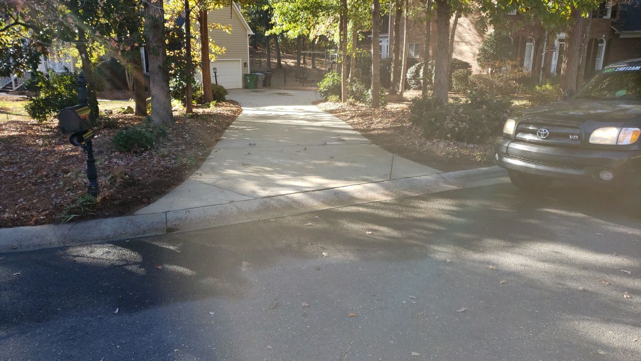 Driveway Clean using cleaner by Power Wash Masters LLC