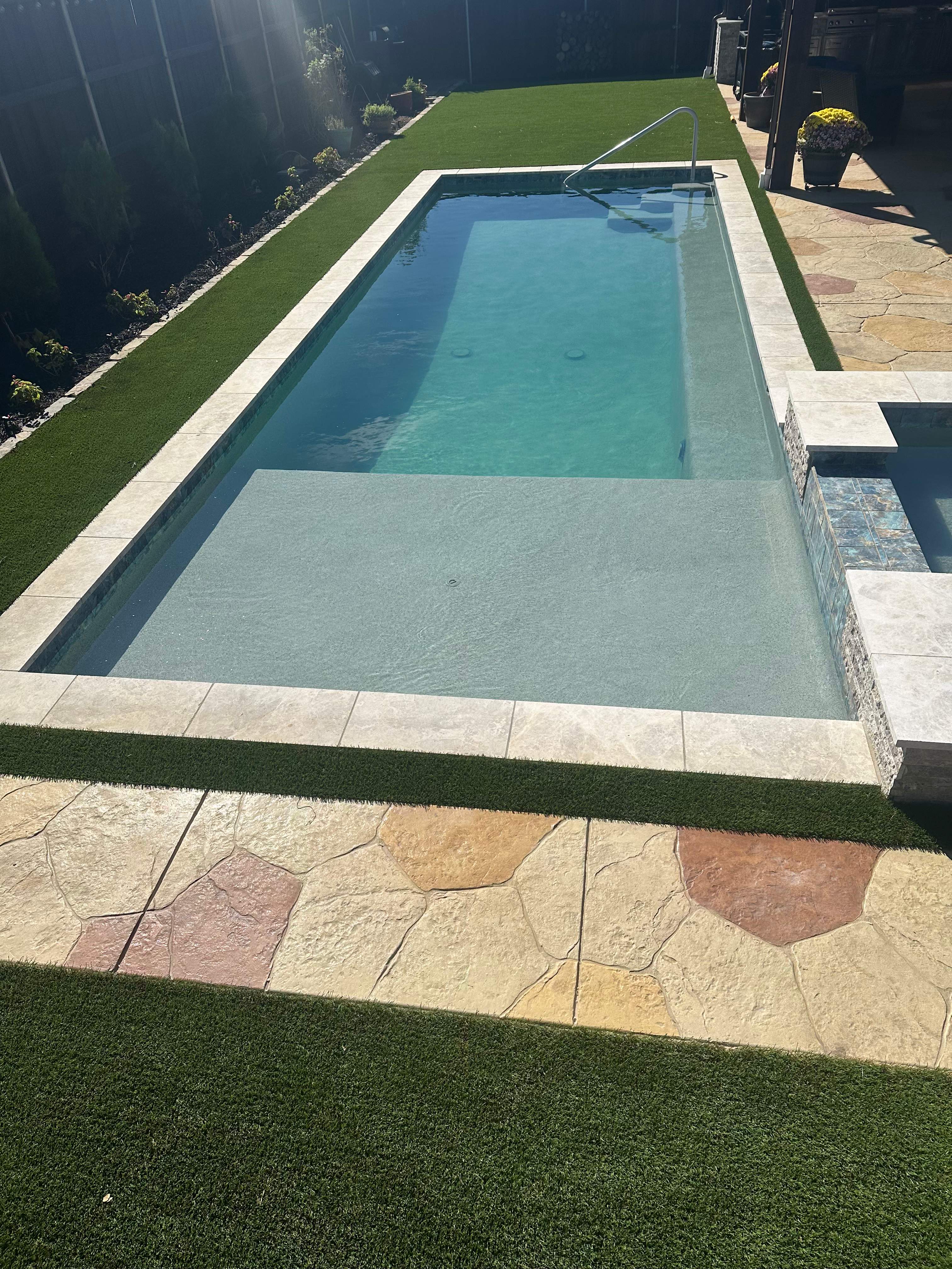Geometric Pool with Raised Stone Spa by Pinnacle Pools and Spas - DFW