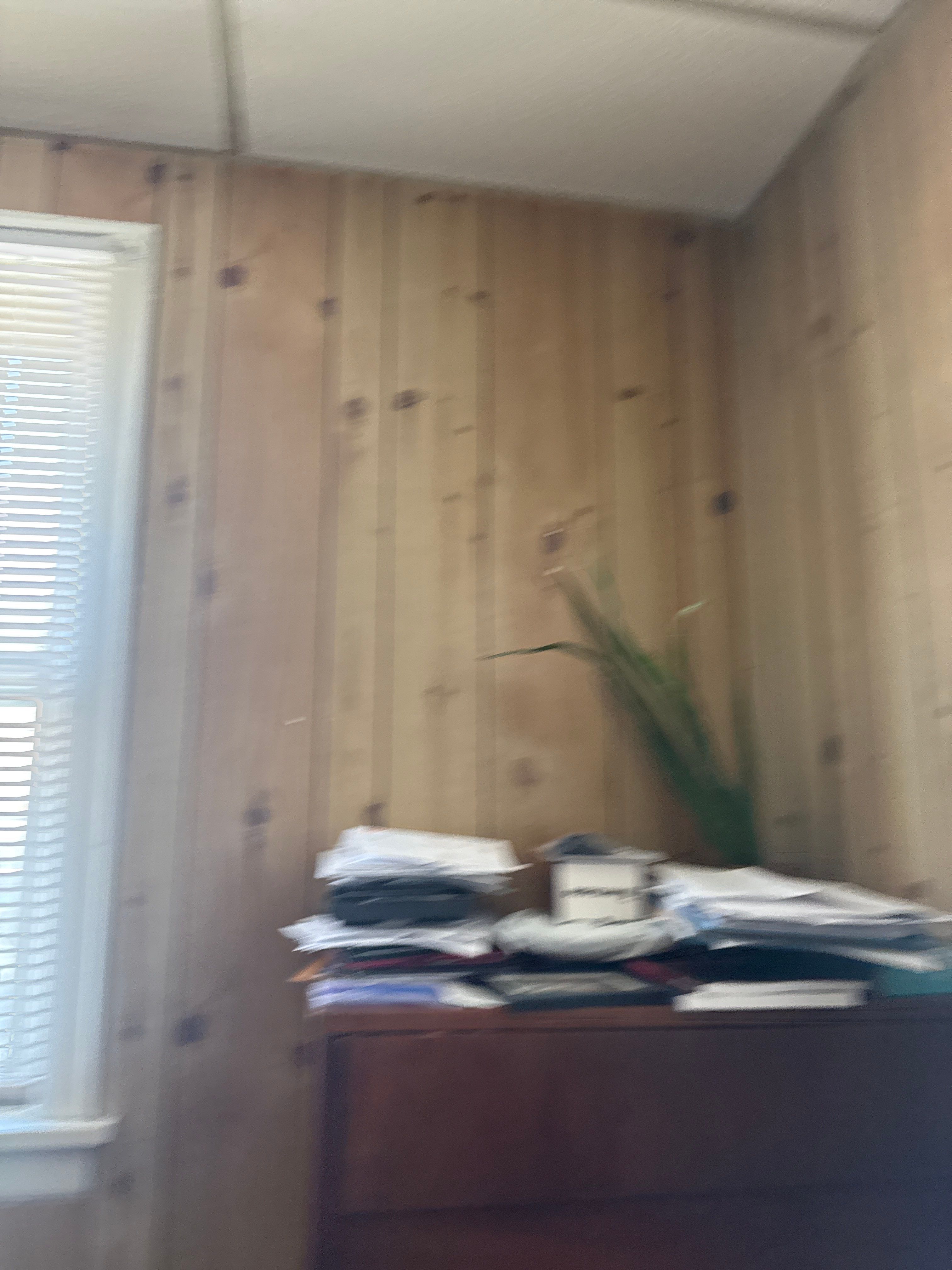 Commercial Office Remodel Featuring Knotty Pine Paneling and Hardwood Floors by CompanyCam Sales Demo