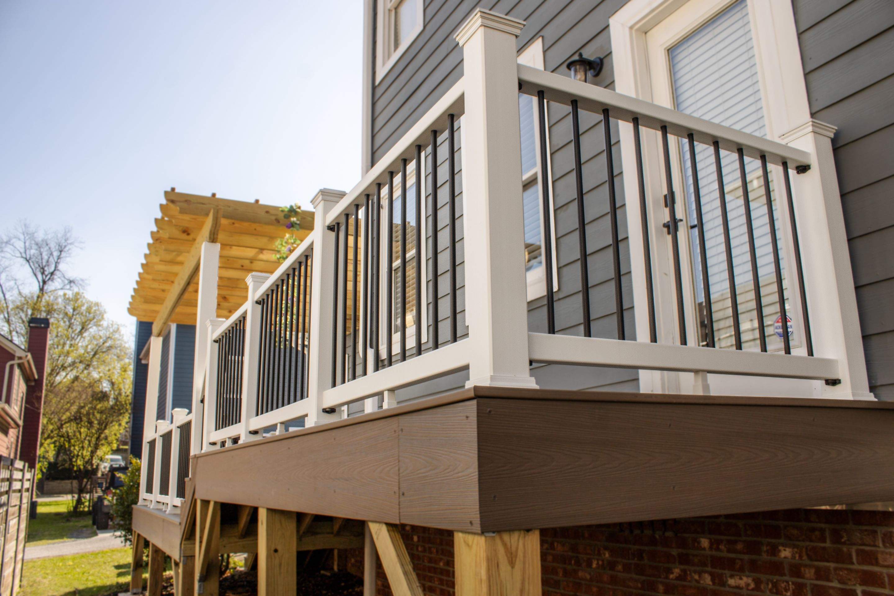 Atlanta, GA Deck Rebuild and Pergola Build using Deckorators Venture Series Decking, Trex Composite Railing, and Pressure Treated Pine by Nelson Exteriors